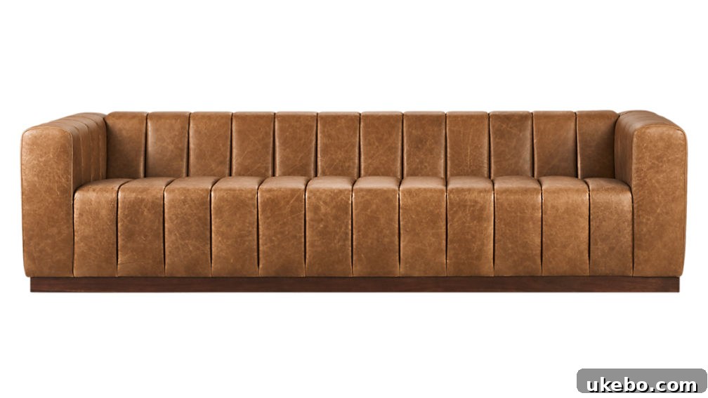 Tan Leather Sofa A Design Muse 14 CB2 Forte Channeled Saddle Leather Sofa, a distinctive modern sofa with channeled back and seat, providing both style and comfort.