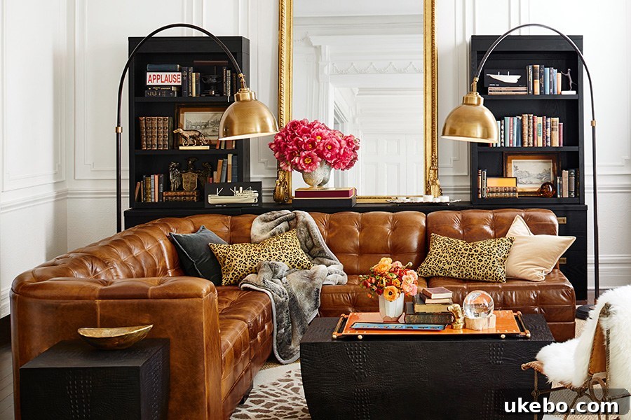 Tan Leather Sofa A Design Muse 4 Sophisticated living area with a tan leather Chesterfield sofa, surrounded by rich textures and dark, classic furnishings.