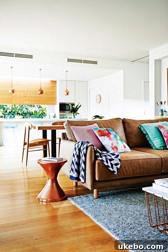 Tan Leather Sofa A Design Muse 7 Contemporary living space with a tan leather sofa, light wooden furniture, and a neutral color palette for a serene look.