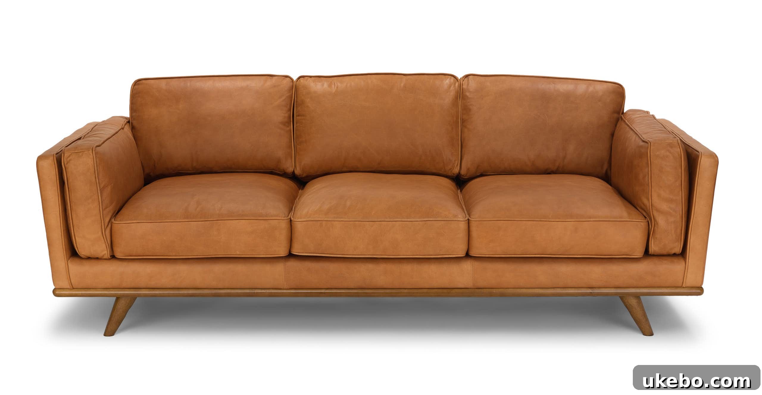 Tan Leather Sofa A Design Muse 9 Article Timber Charme Tan Sofa, a stylish mid-century modern design with a deep seat and relaxed aesthetic.
