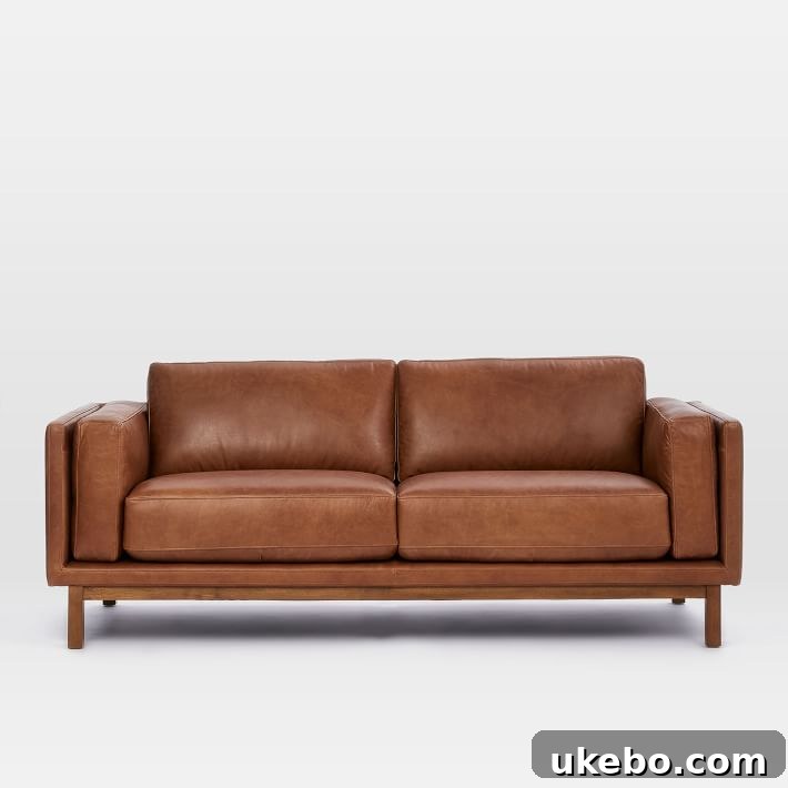 Tan Leather Sofa A Design Muse 10 West Elm Dekalb Leather Sofa, featuring a contemporary design with wide arms and deep seating for ultimate comfort.