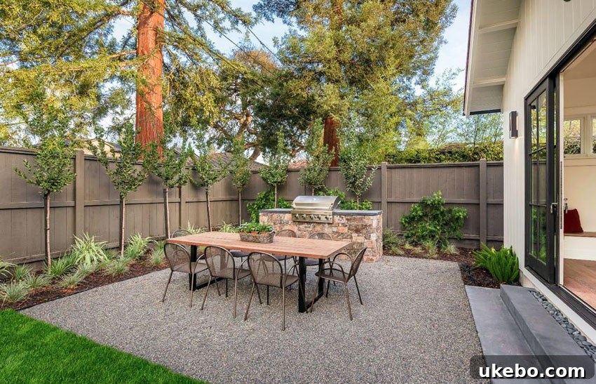 Cozy pea gravel patio with string lights and comfortable seating