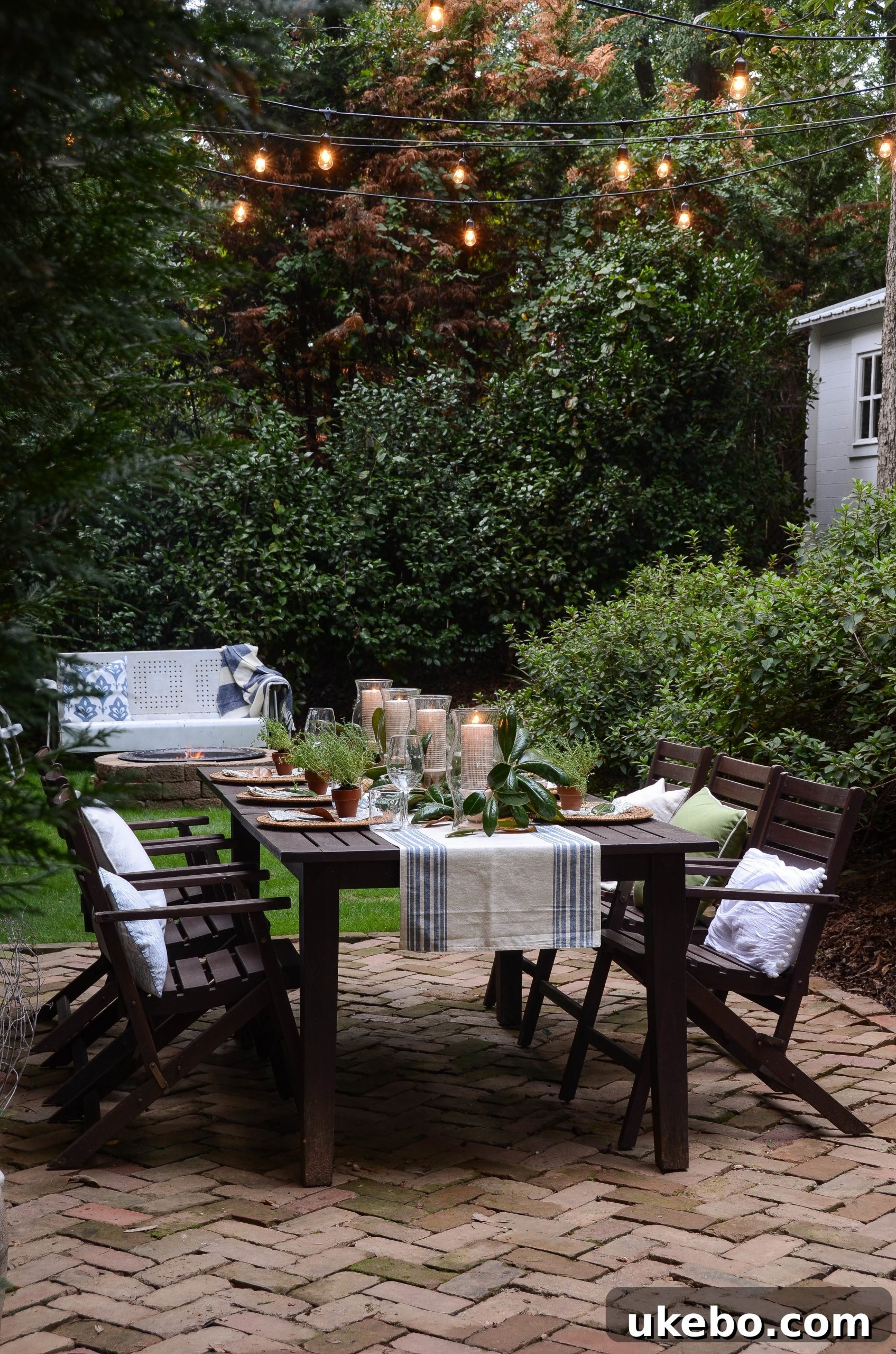 Spacious paver patio with a large outdoor dining table set for Friendsgiving