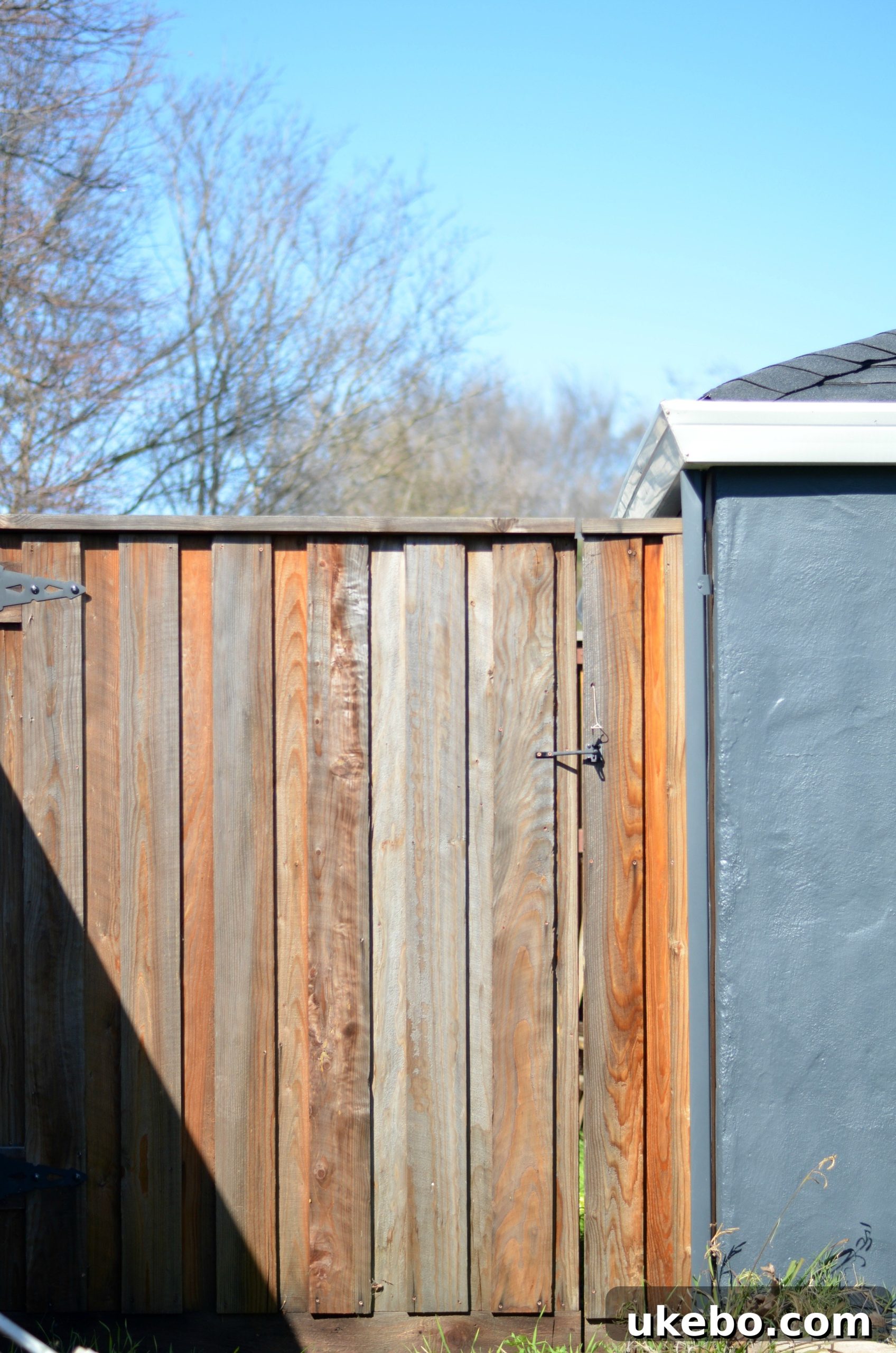Another perspective of the wide gate leading to the bin storage, illustrating easy access.