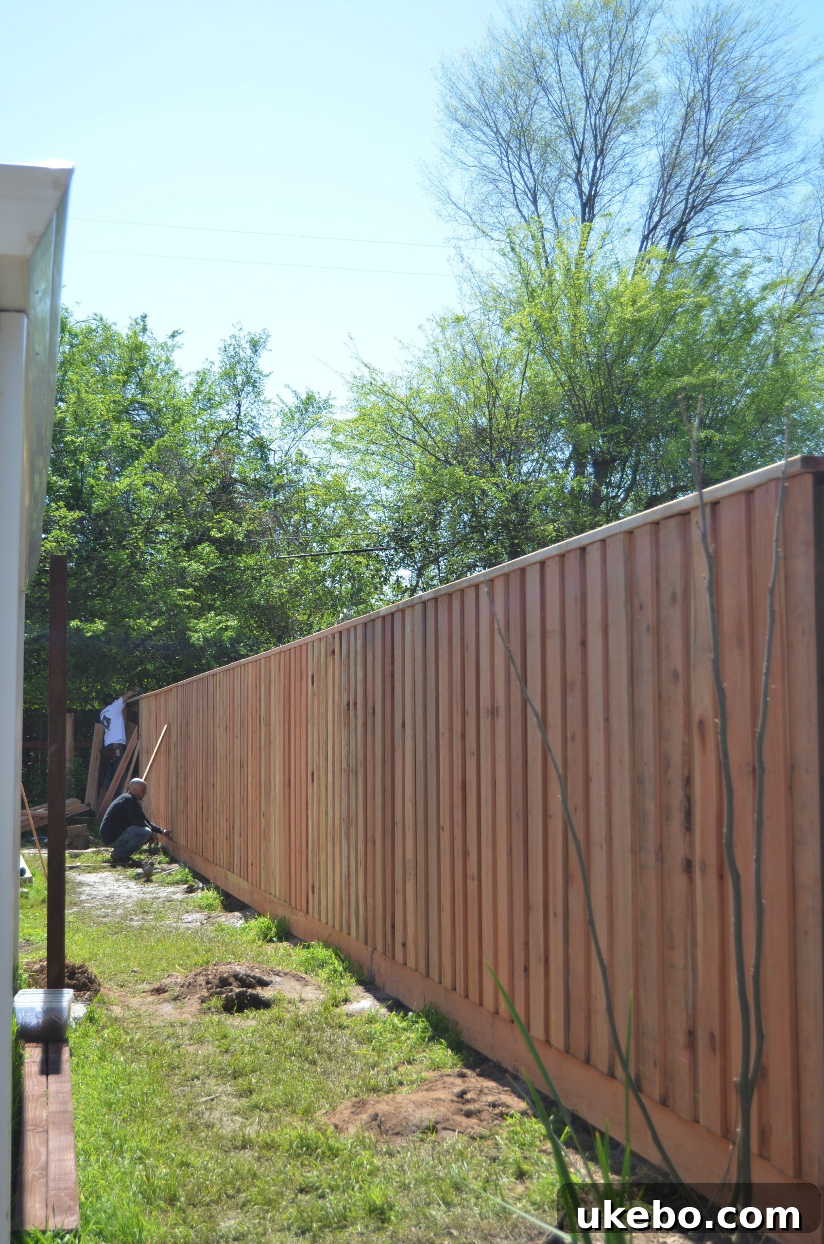 Close-up view of the custom redwood fence, showcasing the quality craftsmanship.