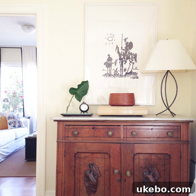 Another view of a neatly kept small space, highlighting minimalist decor and intelligent organization that prevents clutter from overwhelming the room.