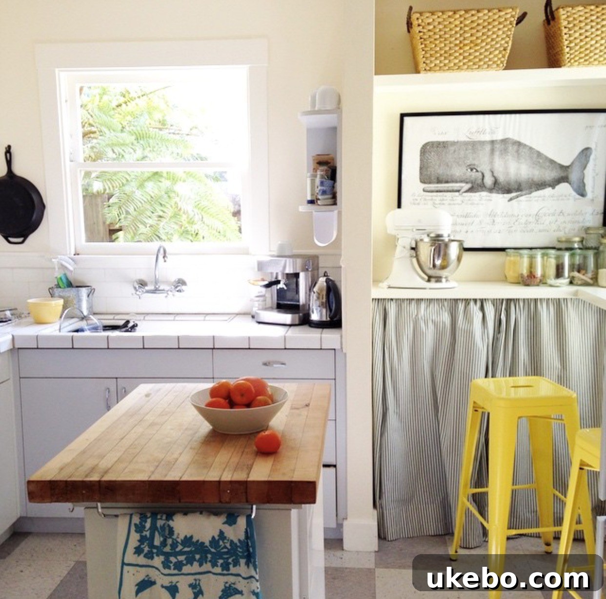 Another view of the vintage kitchen, emphasizing the rustic charm and the smart use of a portable dishwasher as an additional work surface.