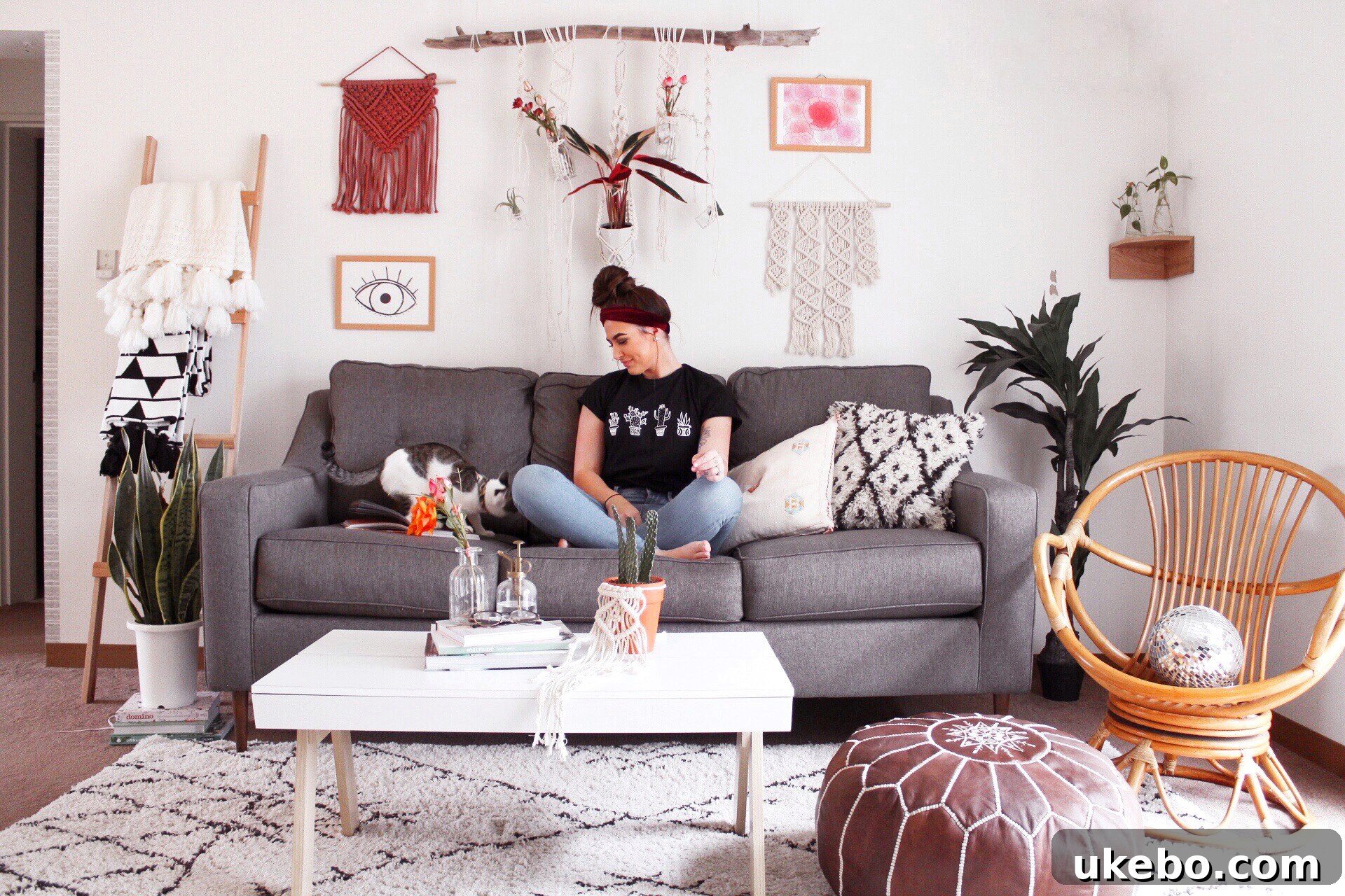 View of a cozy living room with a sofa, throw pillows, and soft lighting.