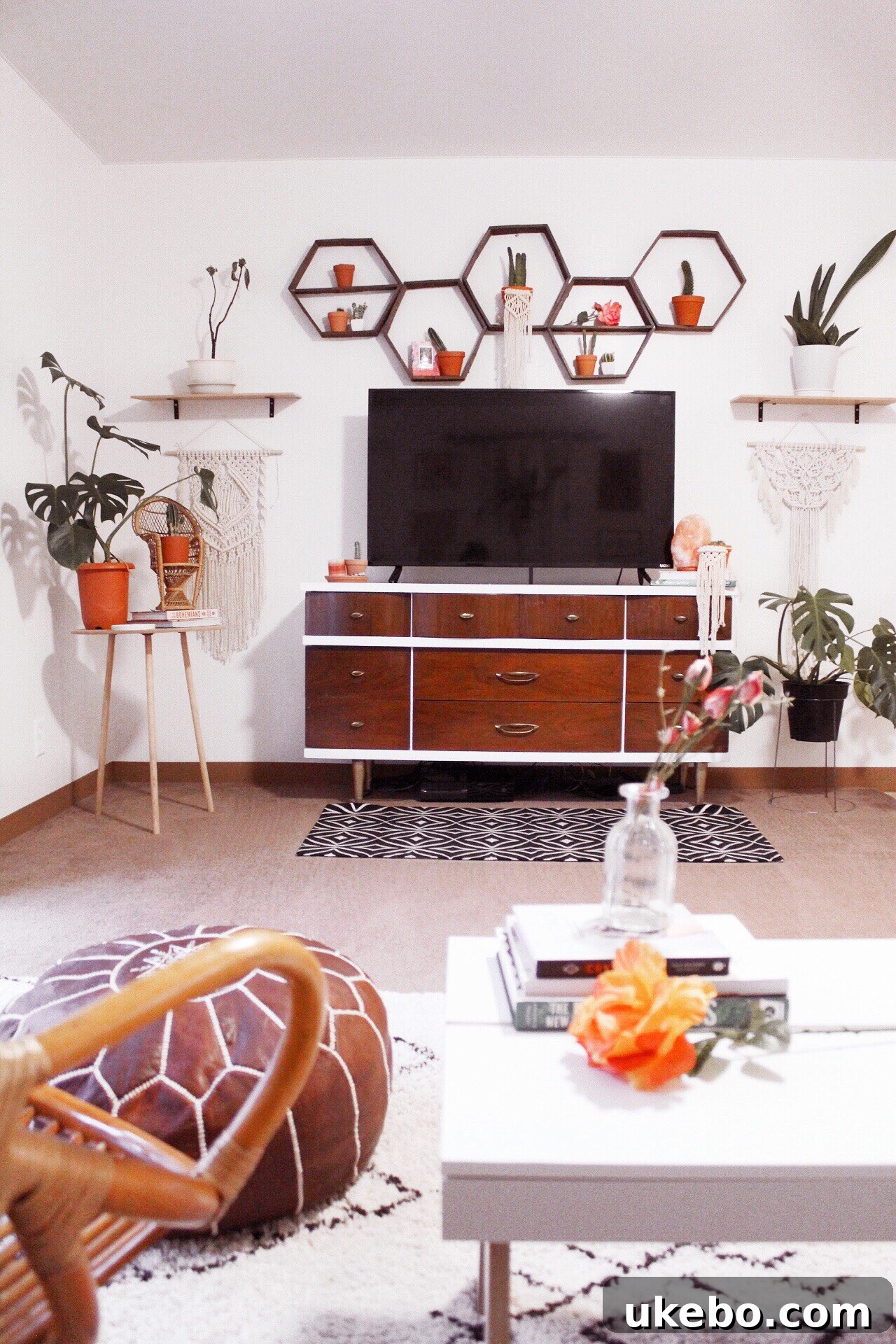 Stylish home office setup with a desk, chair, and plants.
