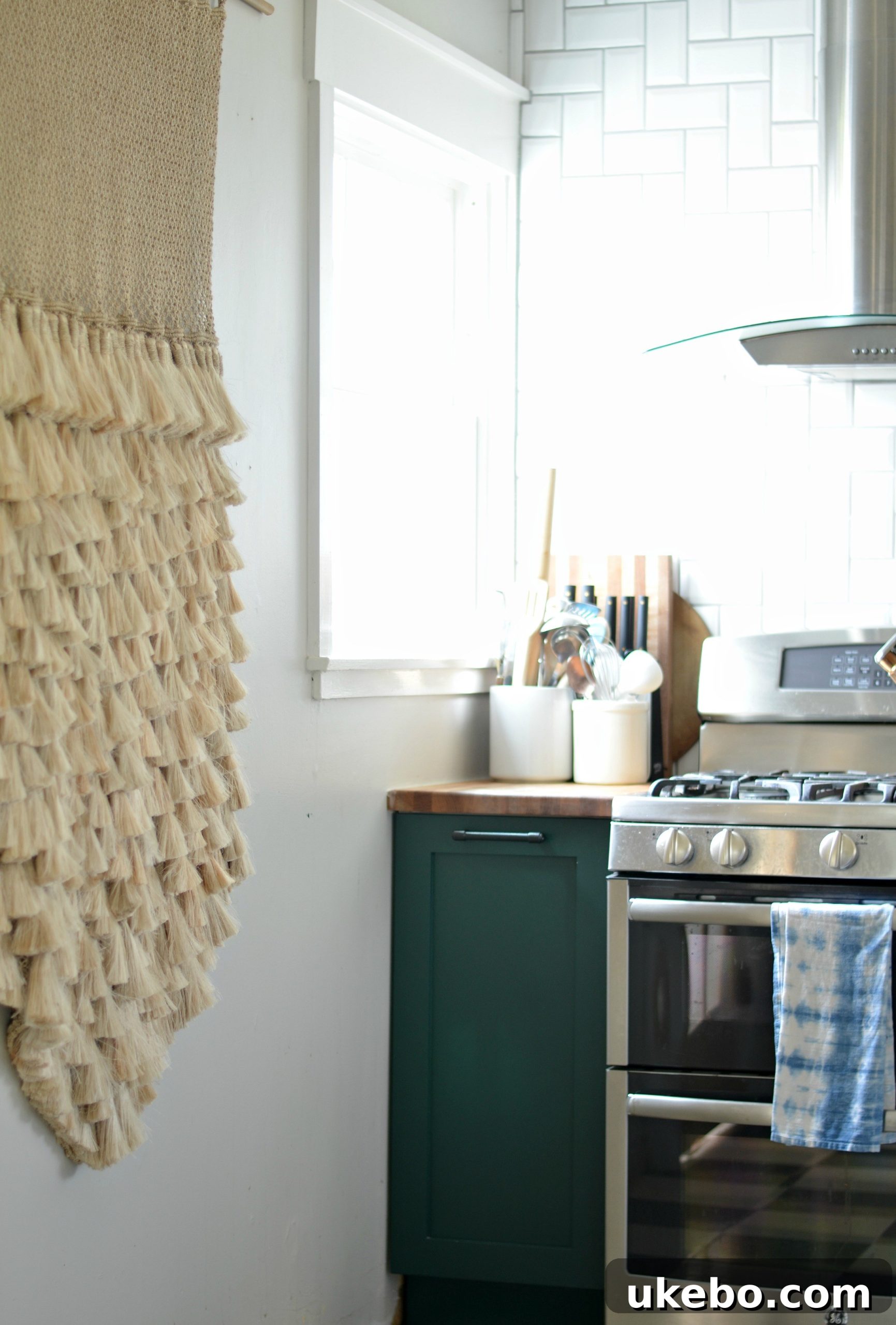 Kitchen view showing copper pot rack and styling elements