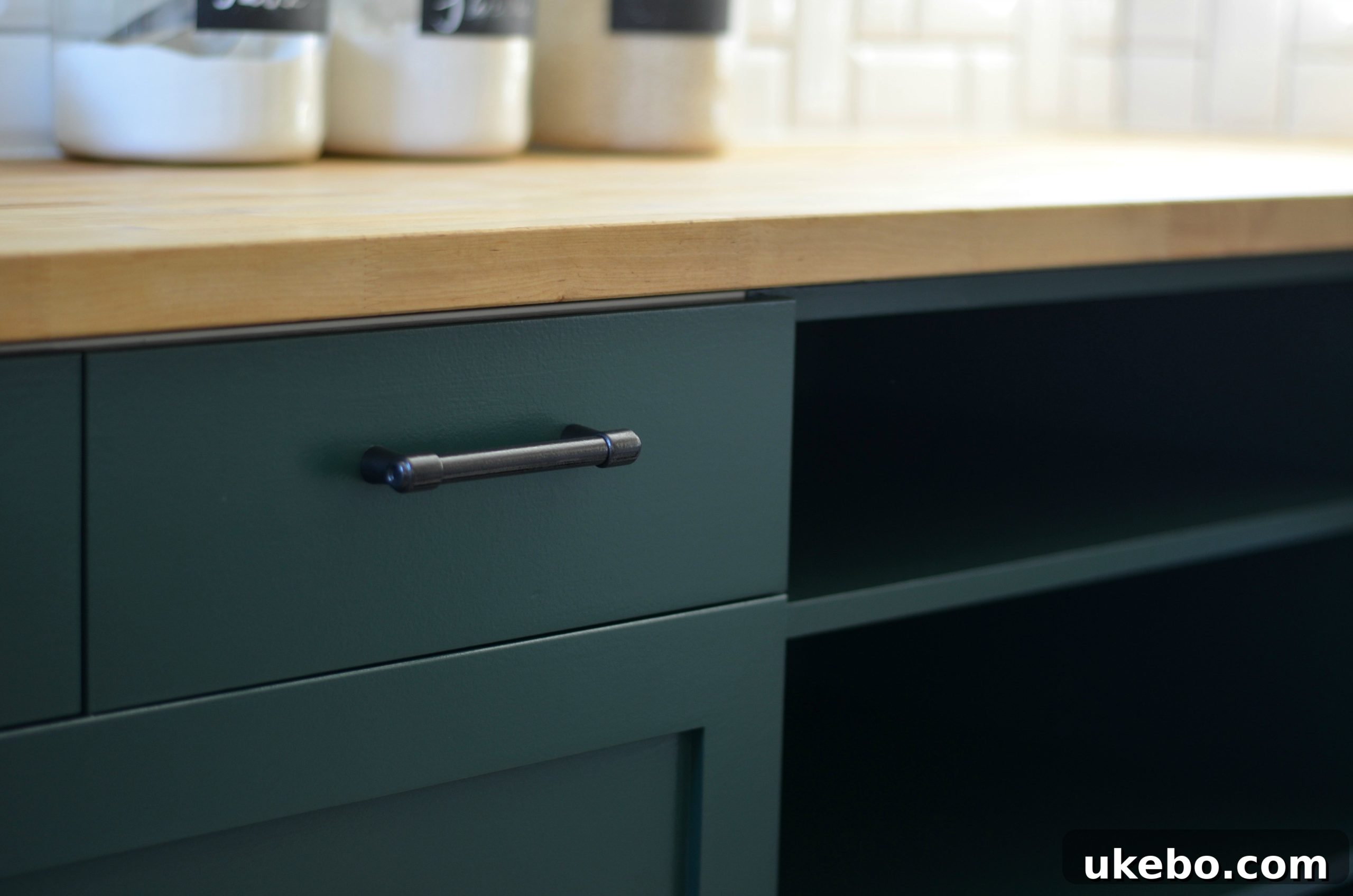 Kitchen cabinets showcasing the smooth, satin finish of Benjamin Moore Hunter Green