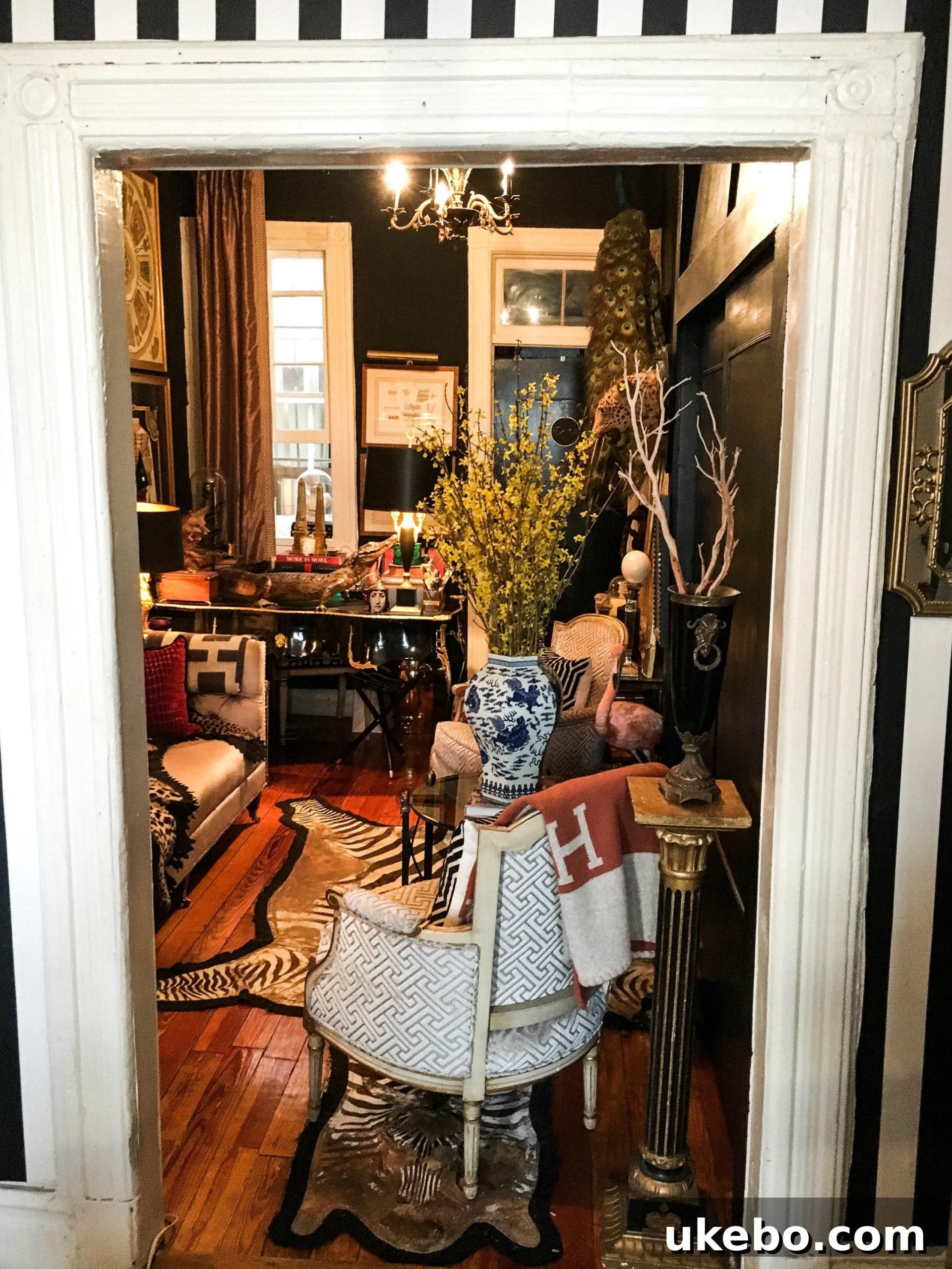 A detailed glimpse into James's thoughtfully designed living area with dark decor, layered textures, and collected objects.