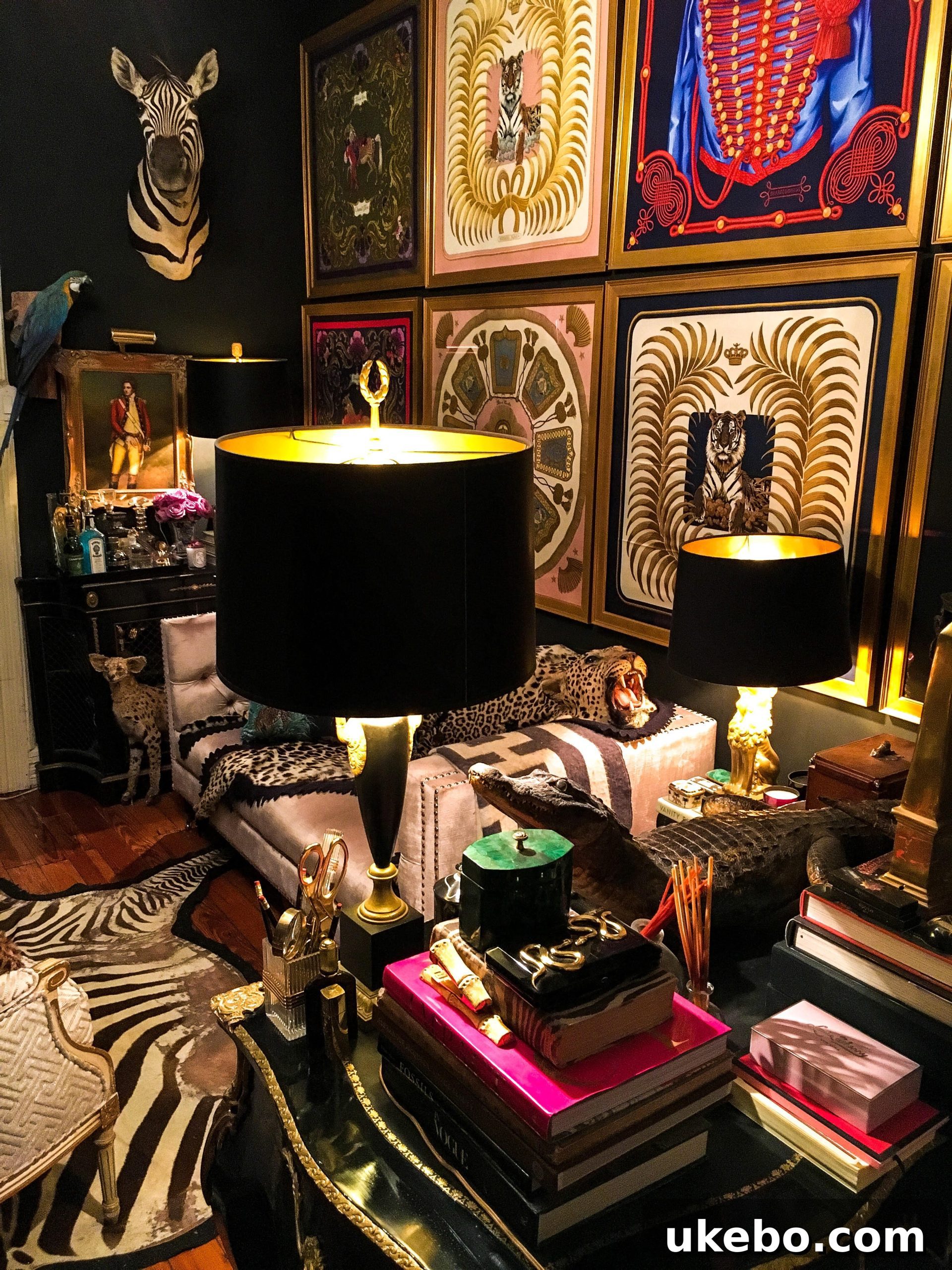 James's richly decorated living room, embodying the 'jewel box' aesthetic with dramatic dark walls, opulent furnishings, and curated items that create a sense of luxurious intimacy.