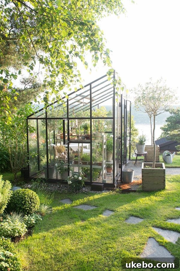 Elegant black greenhouse blending with garden landscape