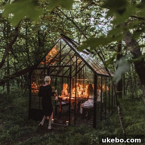 Black greenhouse interior with lush plants and seating