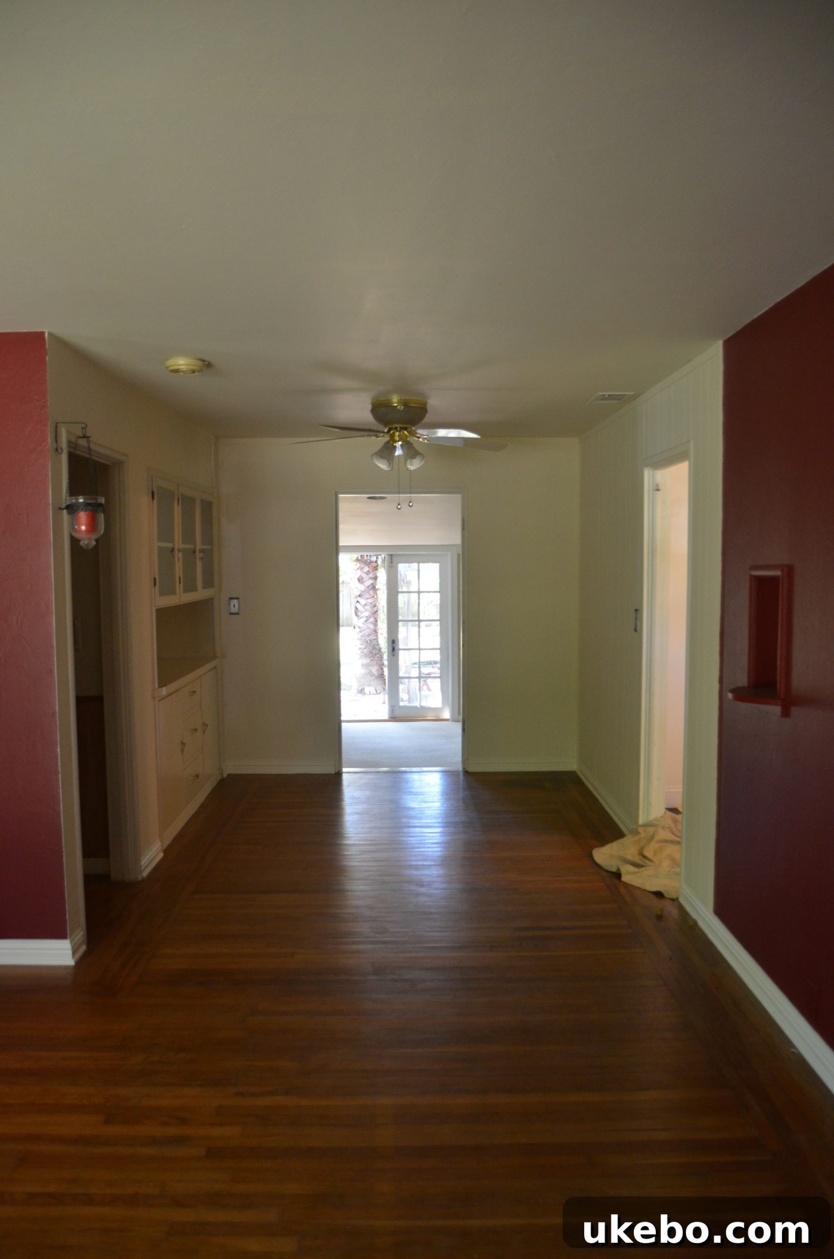 Our Cottage Bungalow Dining Room Makeover Journey 2 Before image of a dining room with old decor and lighting.