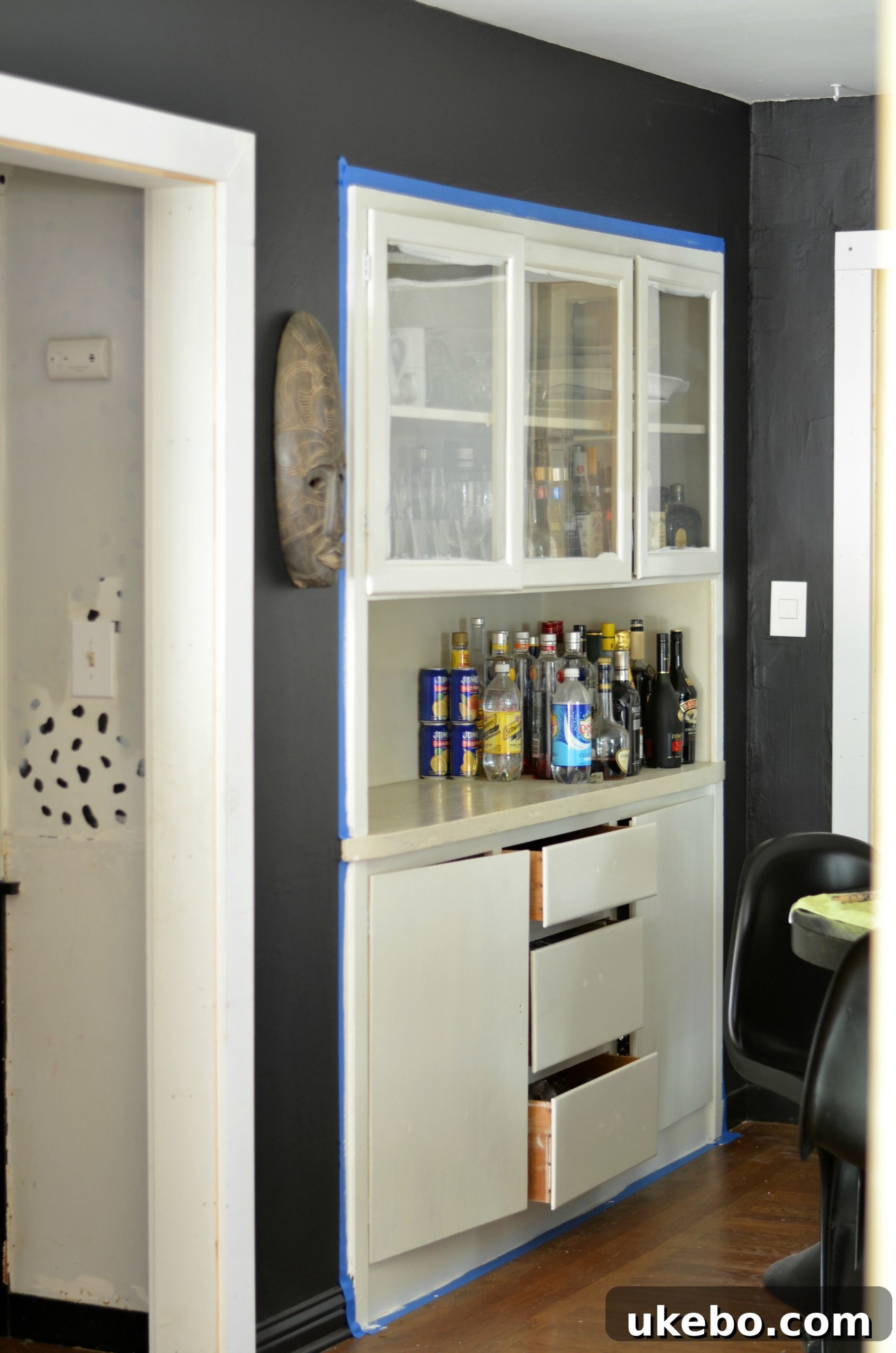 Our Cottage Bungalow Dining Room Makeover Journey 11 Built-in hutch painted white with new glass hardware.