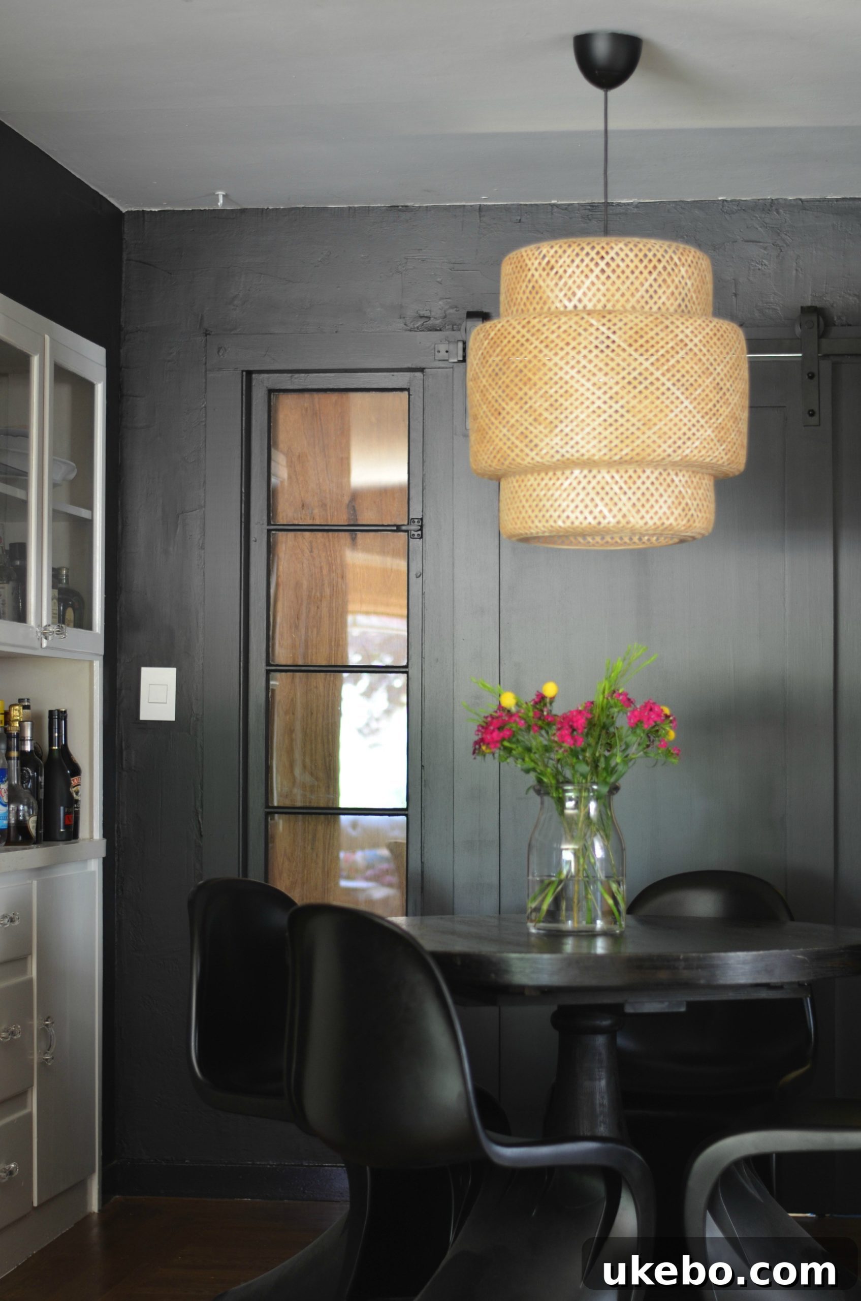 Close-up of the black barn door blending with the wall.