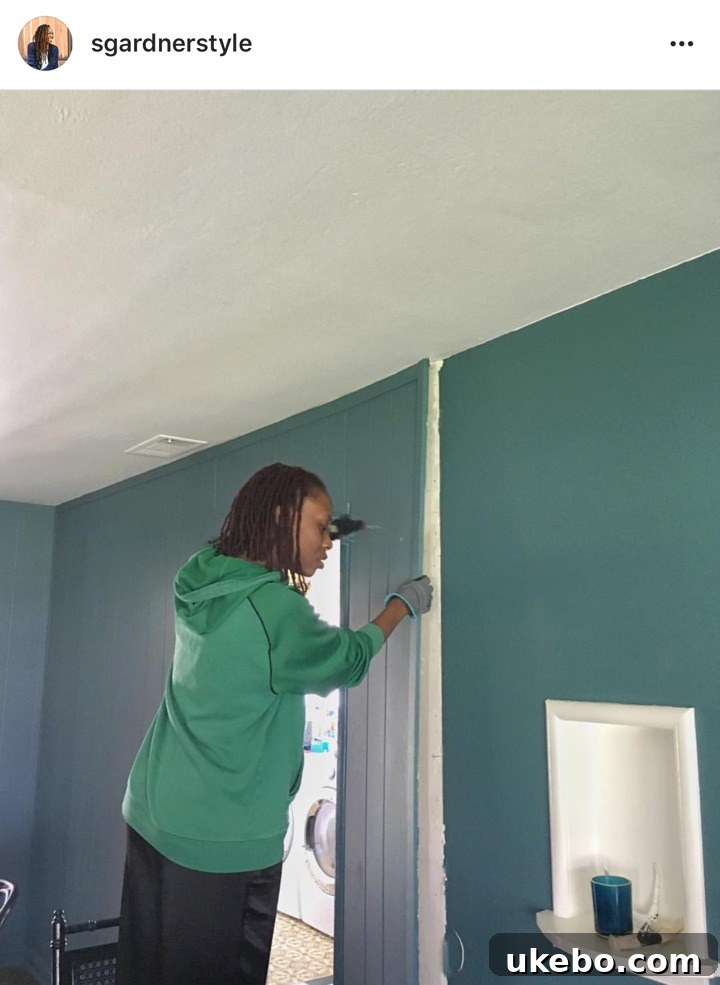 Discovery of hidden windows behind paneling in dining room.