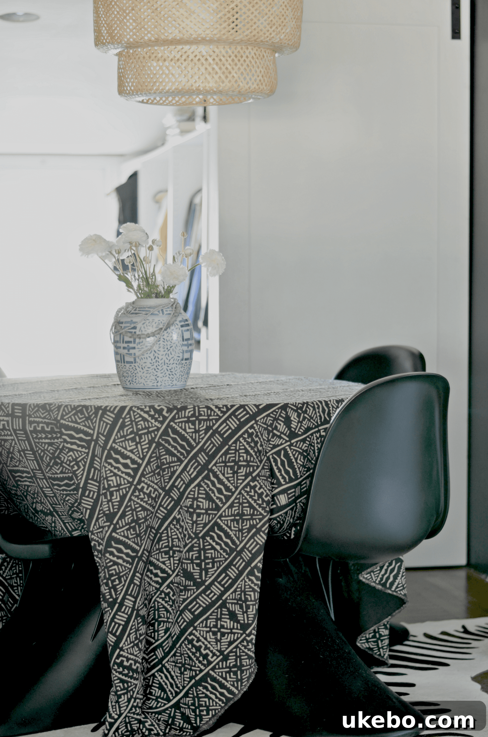 Dining room with new Panton chairs and black walls.