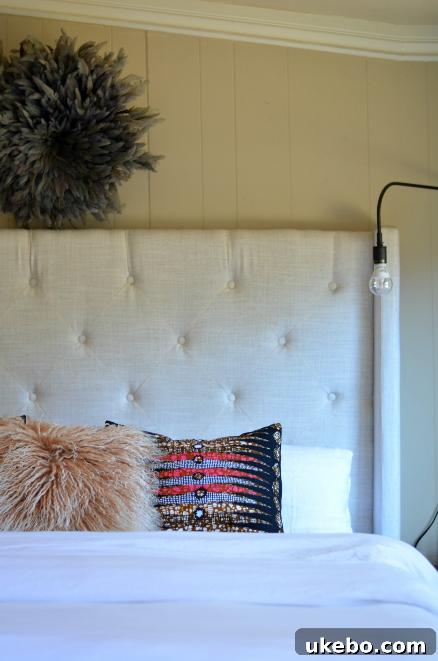 Elegant white bedding on a bed, showcasing the texture and quality of the fabric.