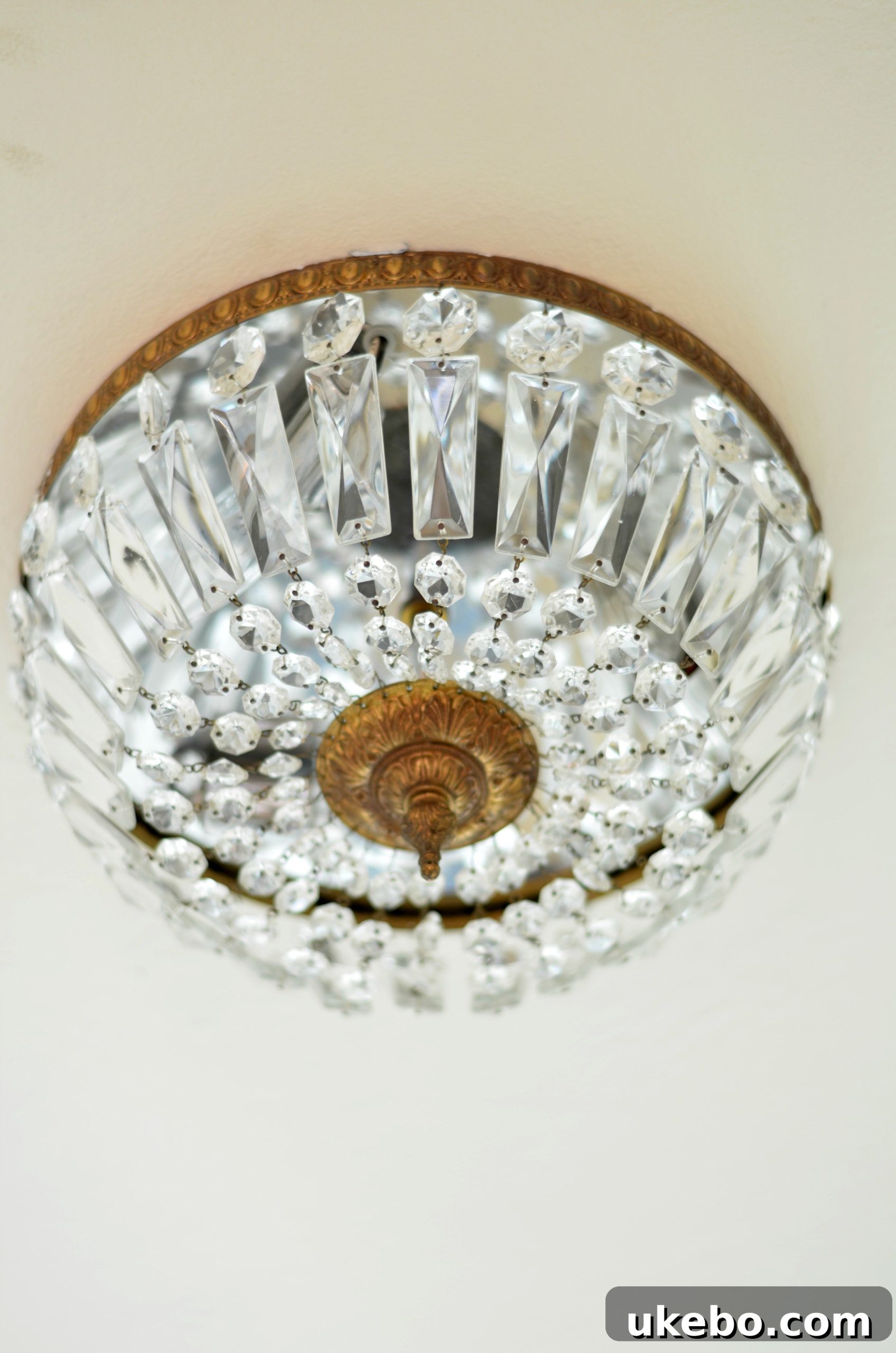 Close-up of a vintage flush mount chandelier with intricate details, highlighting its unique charm.