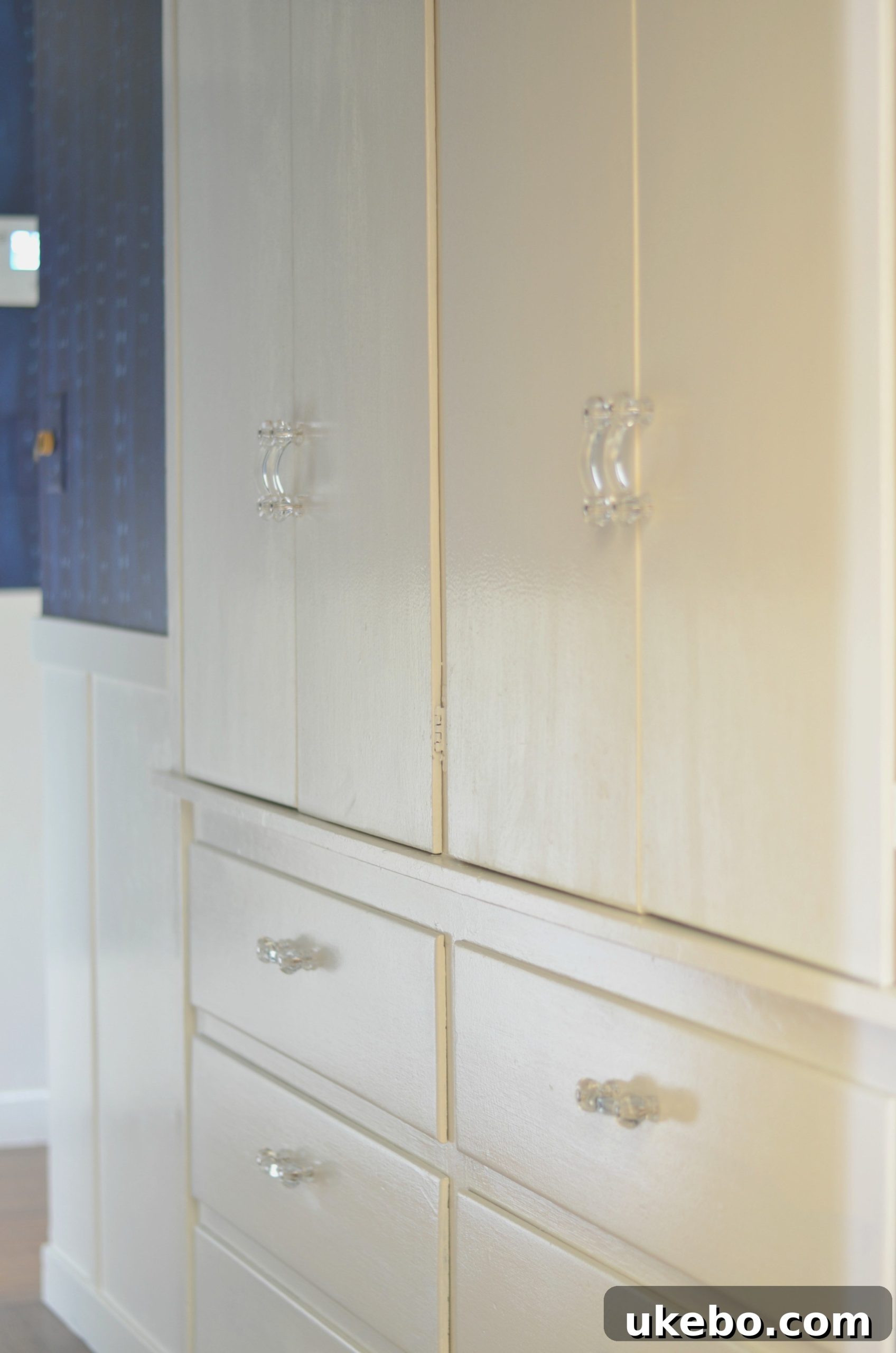 Detailed view of the board and batten wainscoting and updated built-in hardware