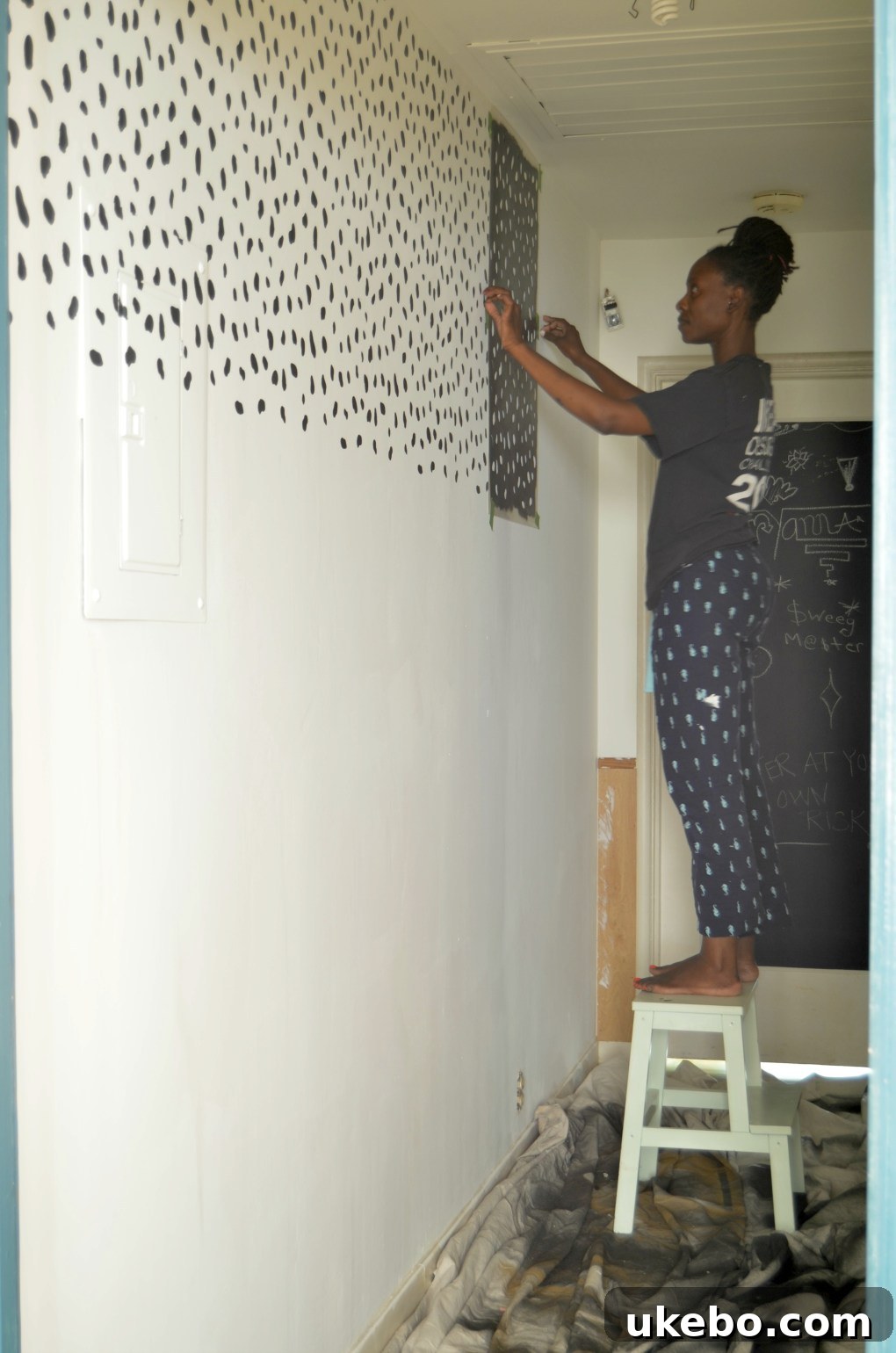 Hallway with temporary dalmatian print stencil and brighter paint