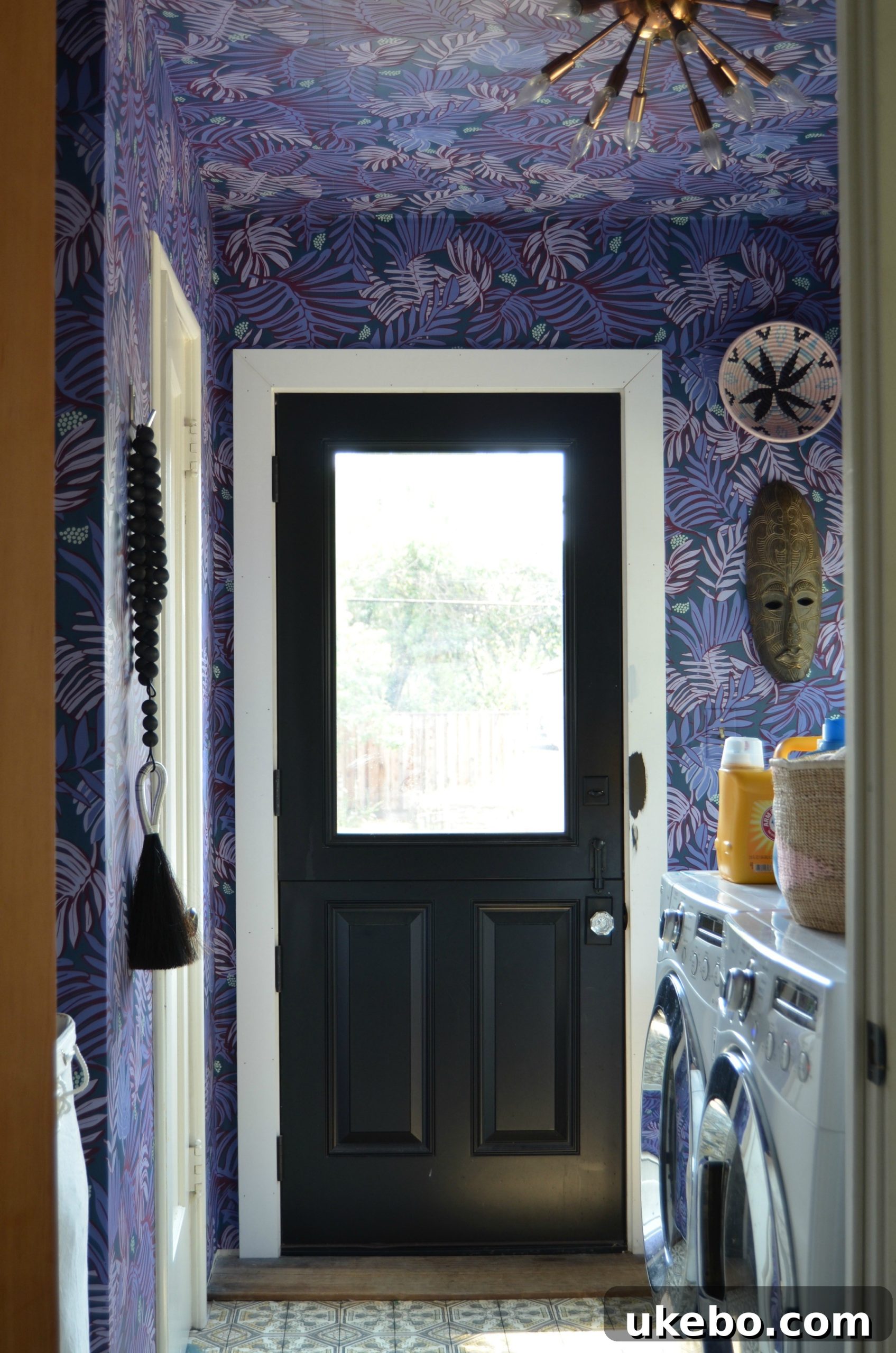 Another view of the laundry room, showing the space around the sink and closet door, awaiting further updates.