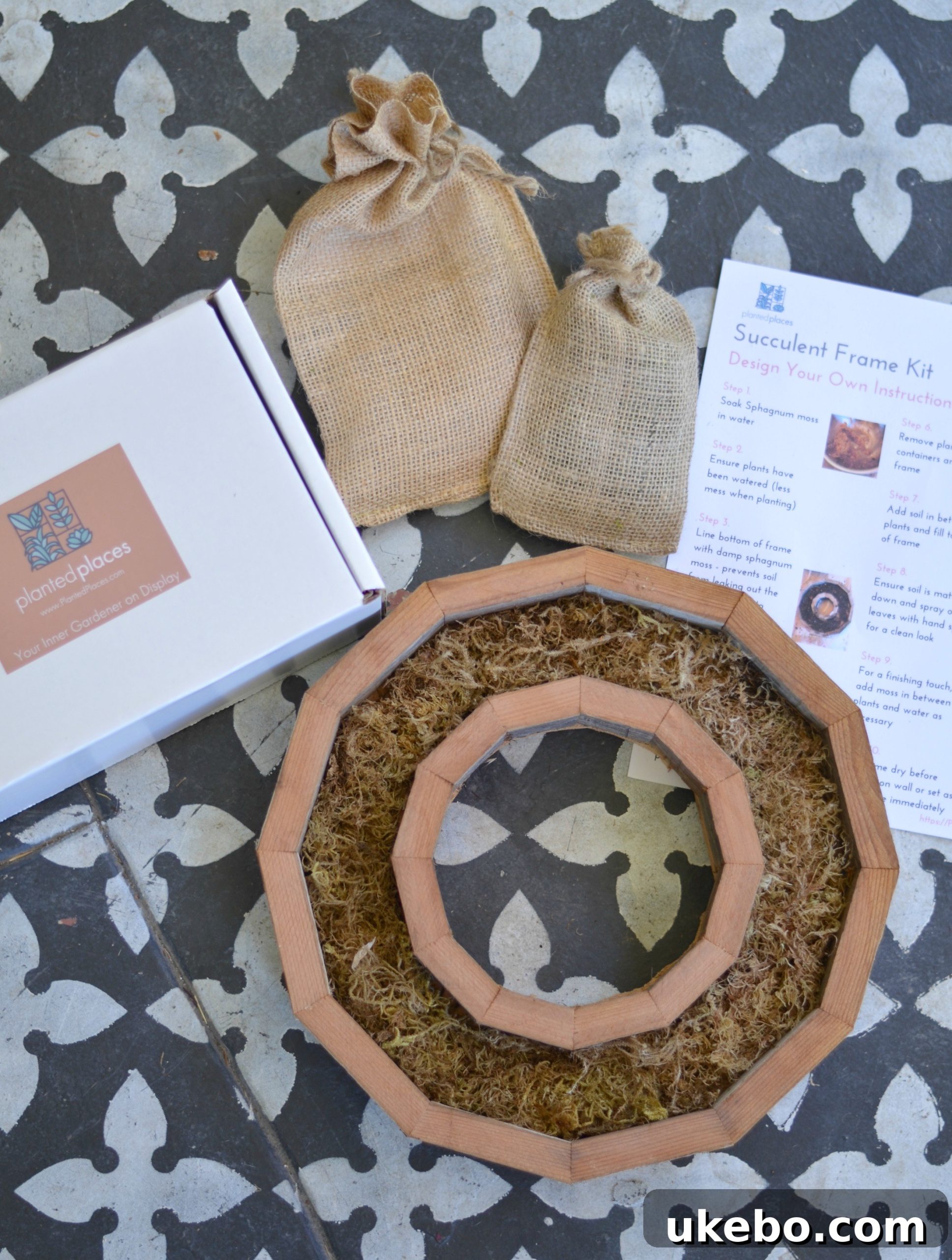 The succulent wreath frame kit laid out on a table, showcasing all the components before assembly.