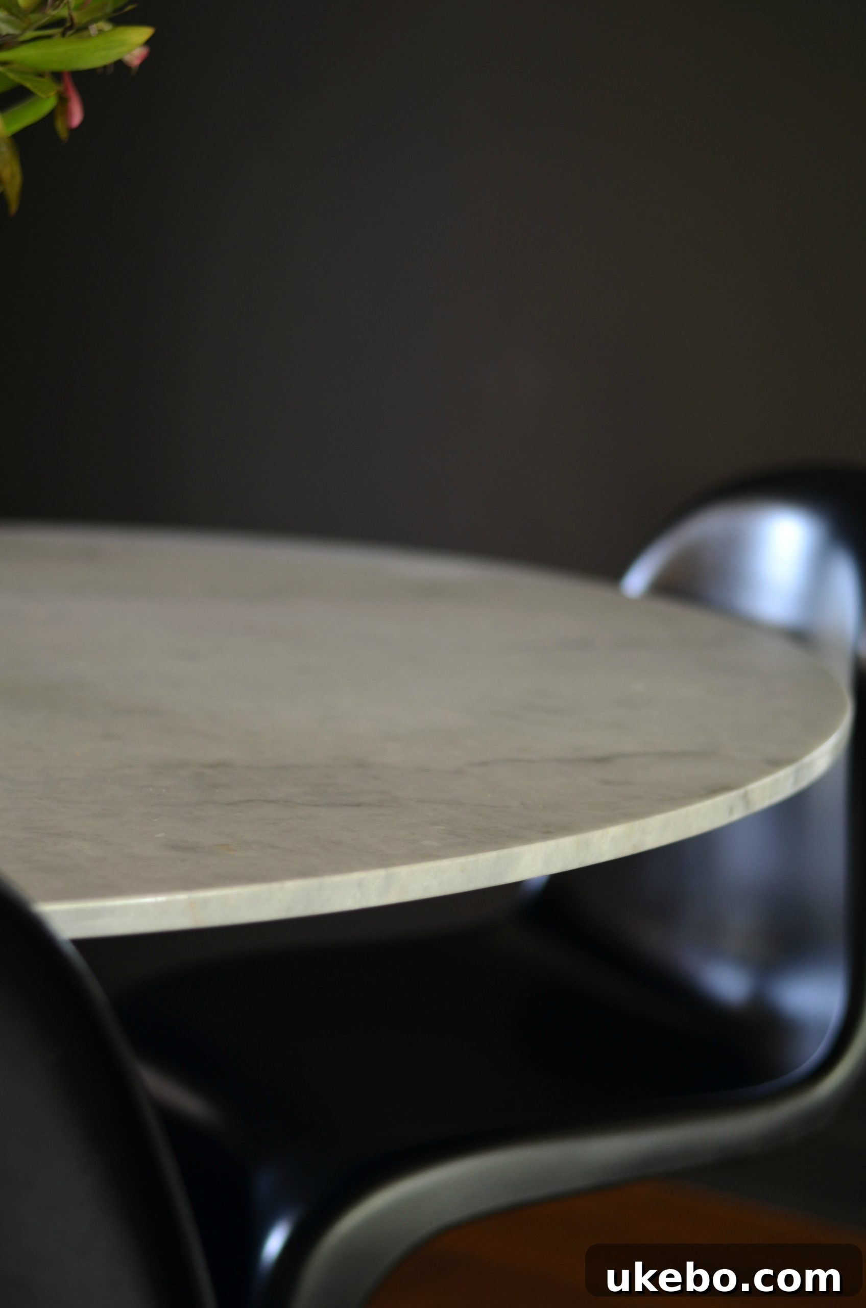 Feather marble dining table with modern chairs in a dining room