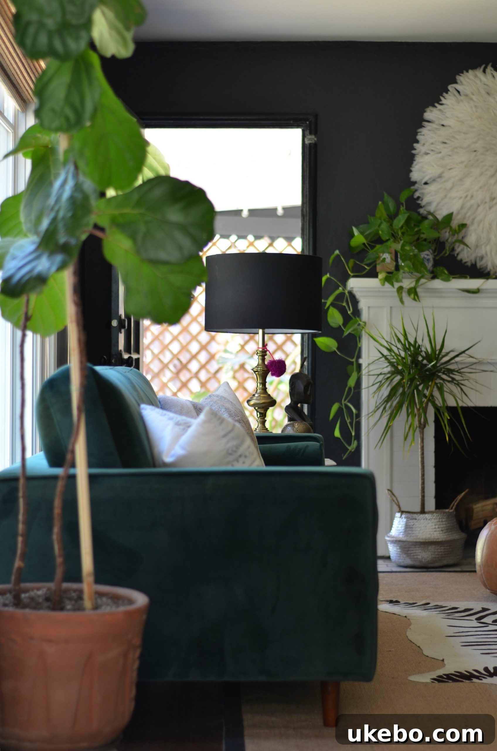 Vibrant green velvet sofa in a sunlit living room