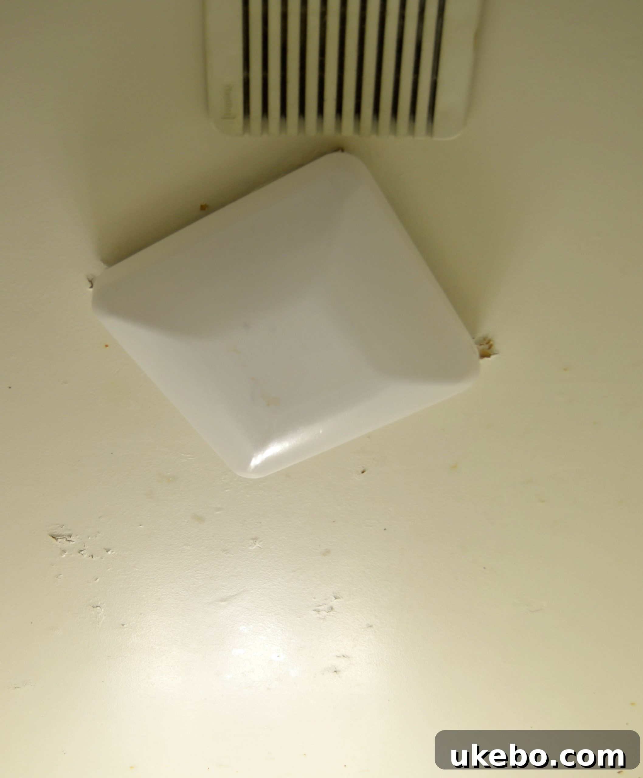 One Room Challenge Week 1 The Design Blueprint 8 Close-up of the dysfunctional light fixture and poor ventilation area in the bathroom