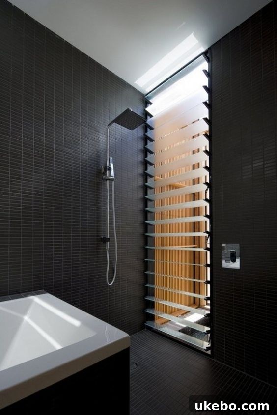 One Room Challenge Week 2: Demolition Day, Unexpected Hurdles, and Plan B 11 Example of continuous black tile design in a small bathroom