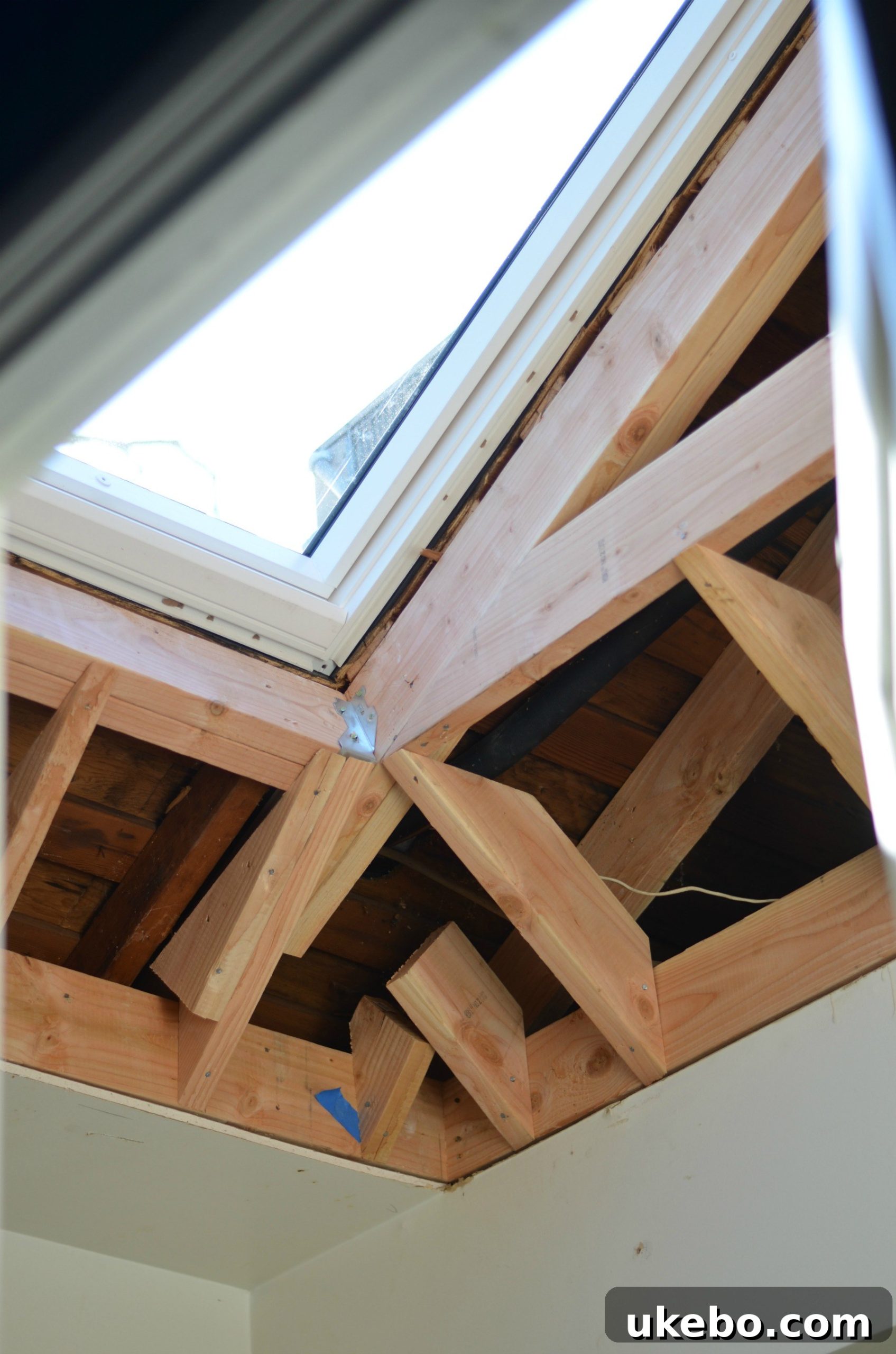 A bright, modern bathroom featuring a new Velux skylight, with abundant natural light filling the space.