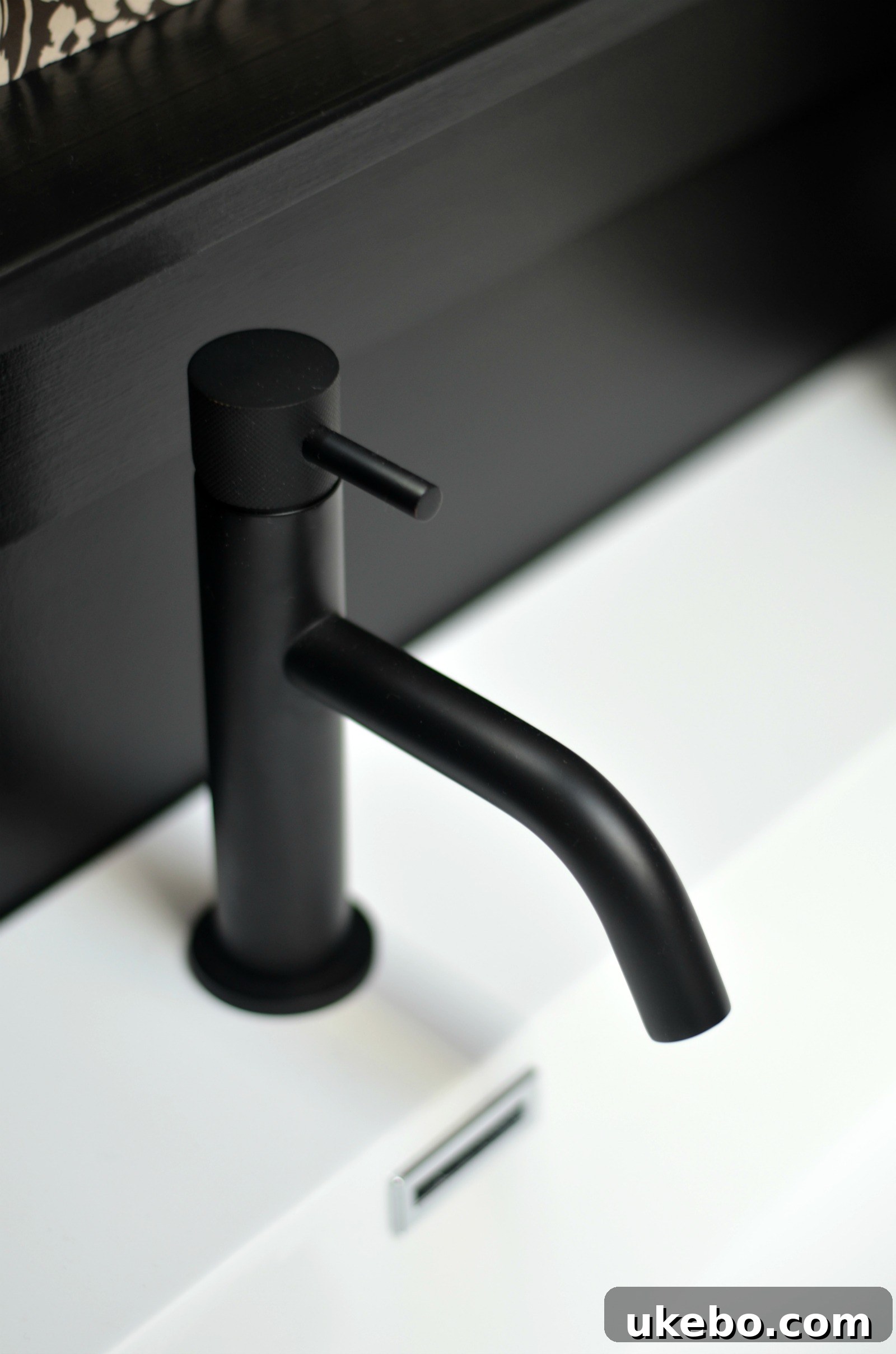Brass MPRO faucet with knurl detail against hex tiles