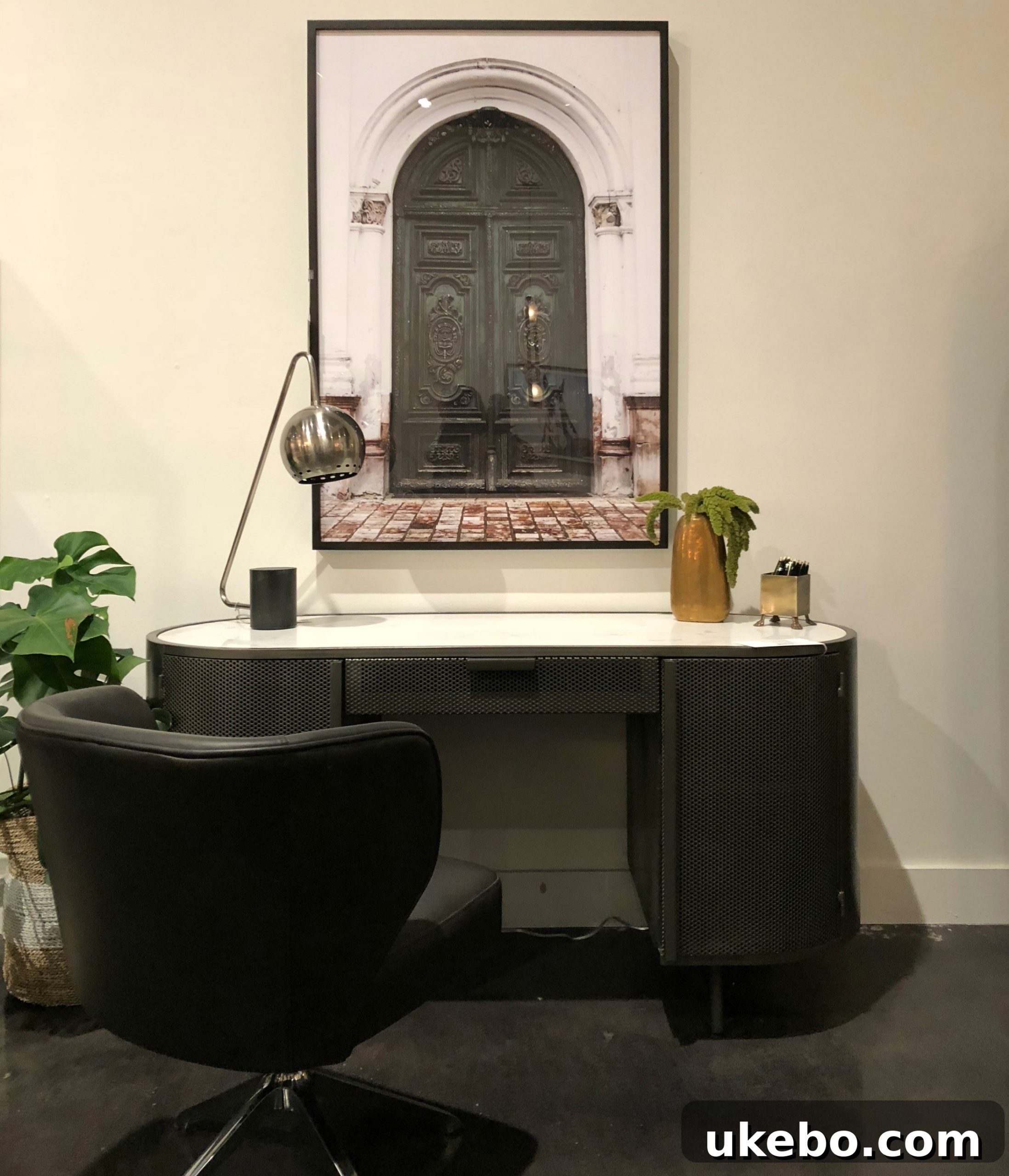 Four Hands furniture piece featuring hard metal material beautifully shaped into a rounded design, an innovative fusion.