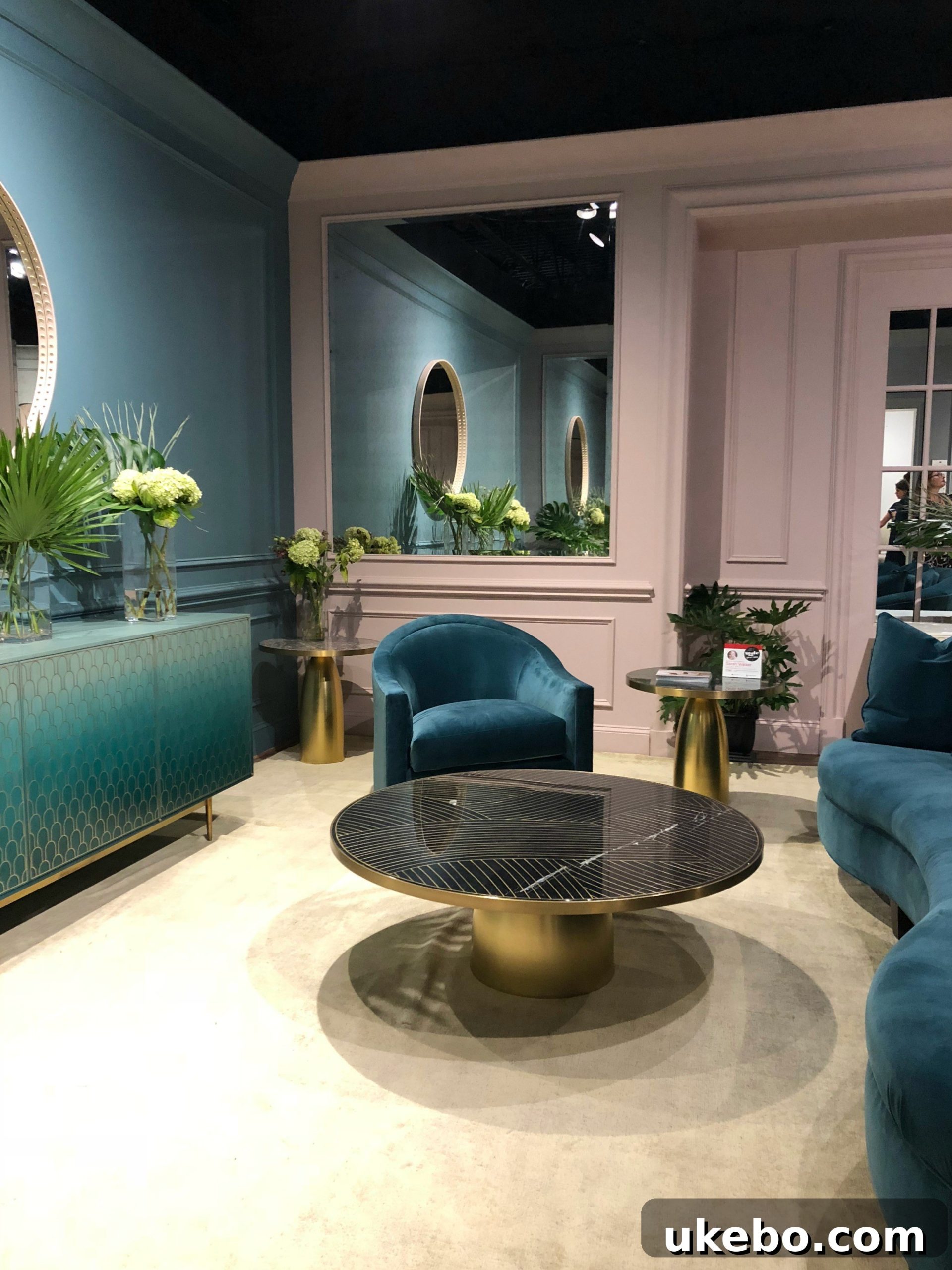 EJ Victor showcasing Kelly Wearstler's new collection with dramatic curved furniture pieces, embodying sophisticated luxury.