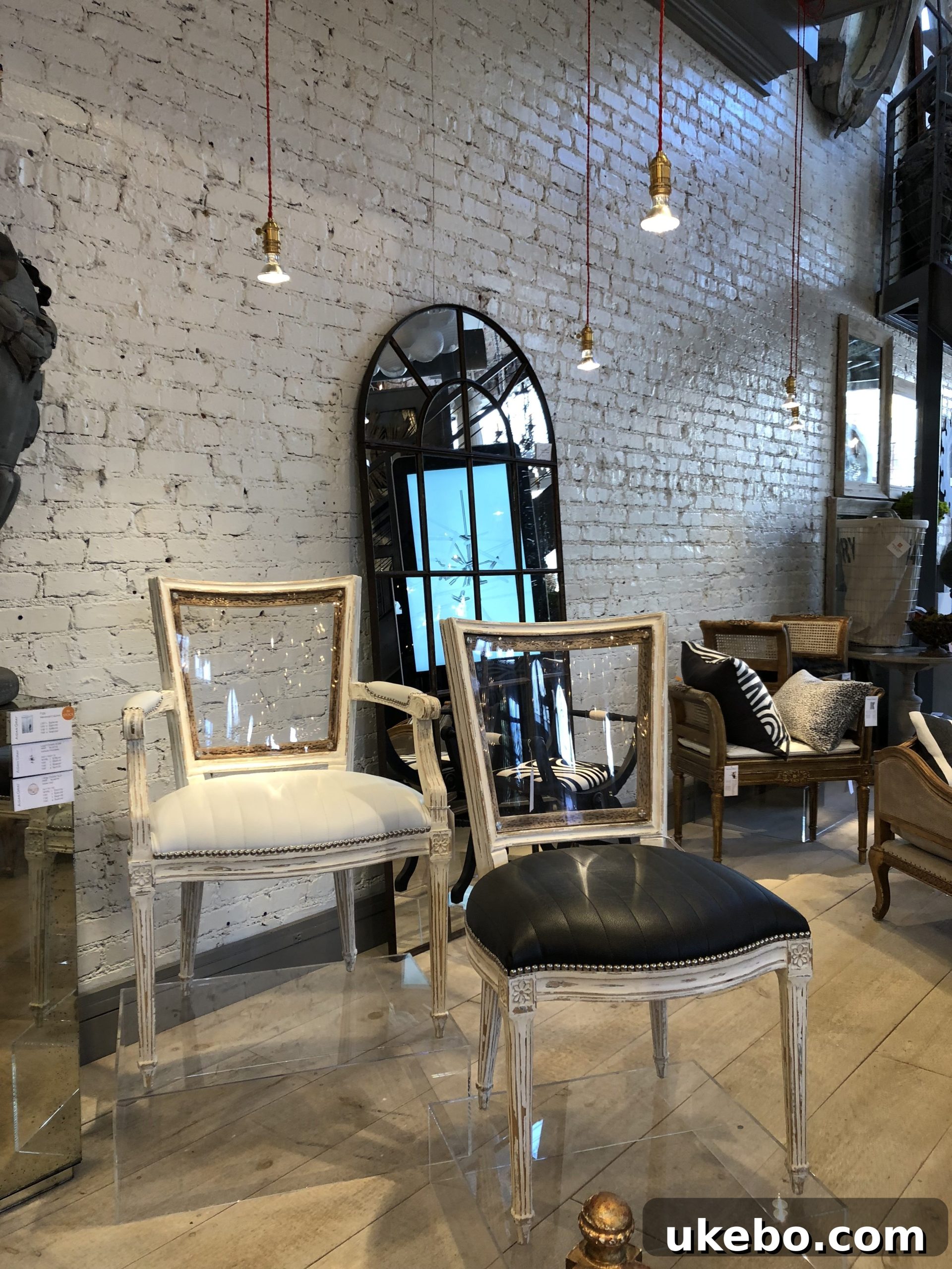 High Point Market Trendscape Volume 3 13 Another Aiden Gray piece, blending classic design with contemporary lucite elements, epitomizing livable luxury.