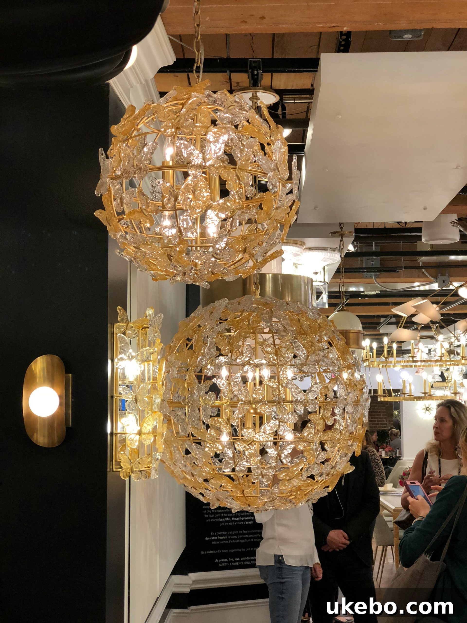 High Point Market Trendscape Volume 3 3 Hudson Valley Lighting fixture with interesting metal finishes and layered glass, embodying visual texture.