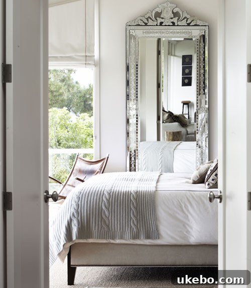 Elegant Venetian style floor-length mirror in a tastefully decorated room.
