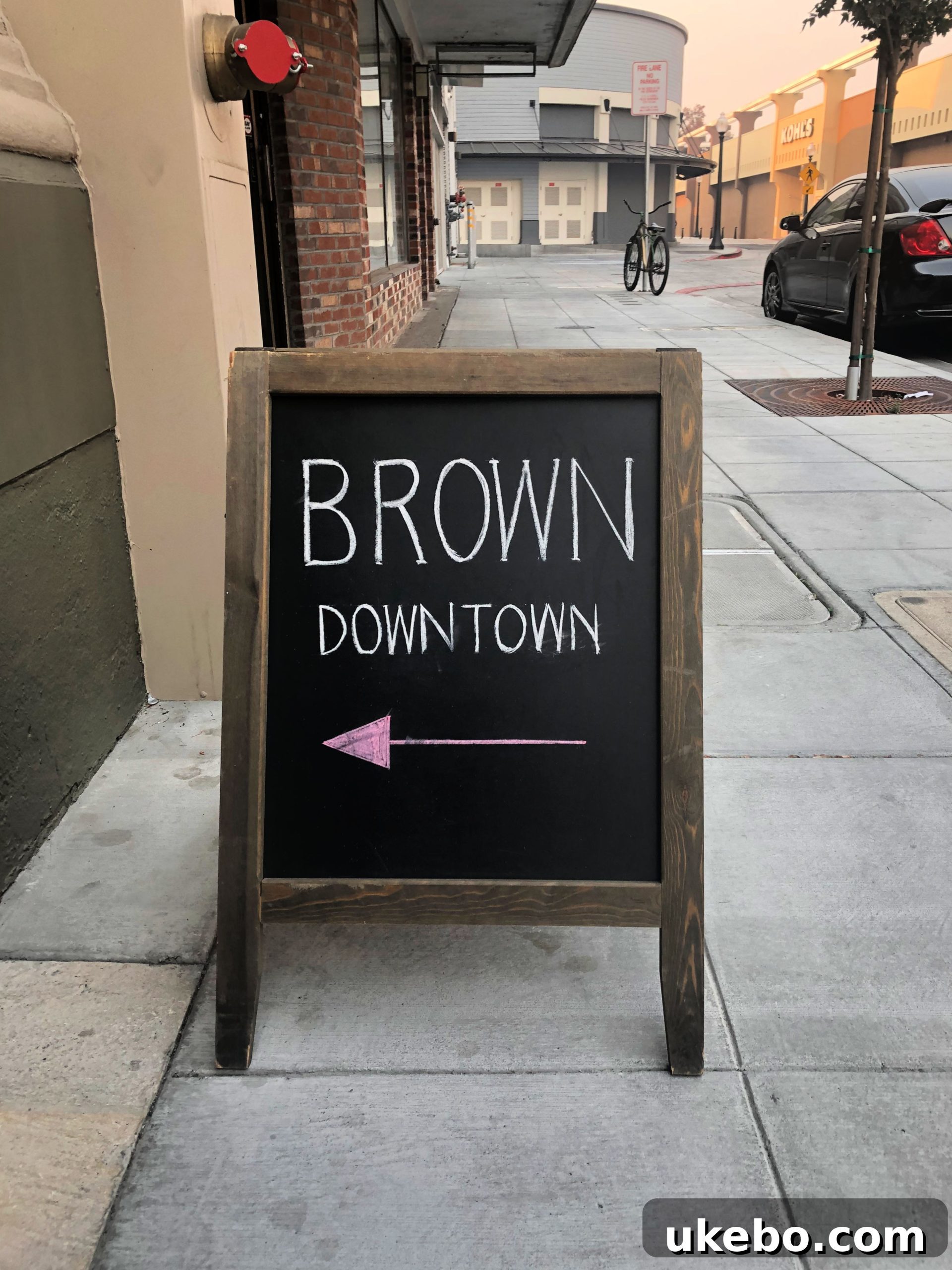 Interior of Brown Estate's downtown tasting room, featuring wine bottles and stylish decor.