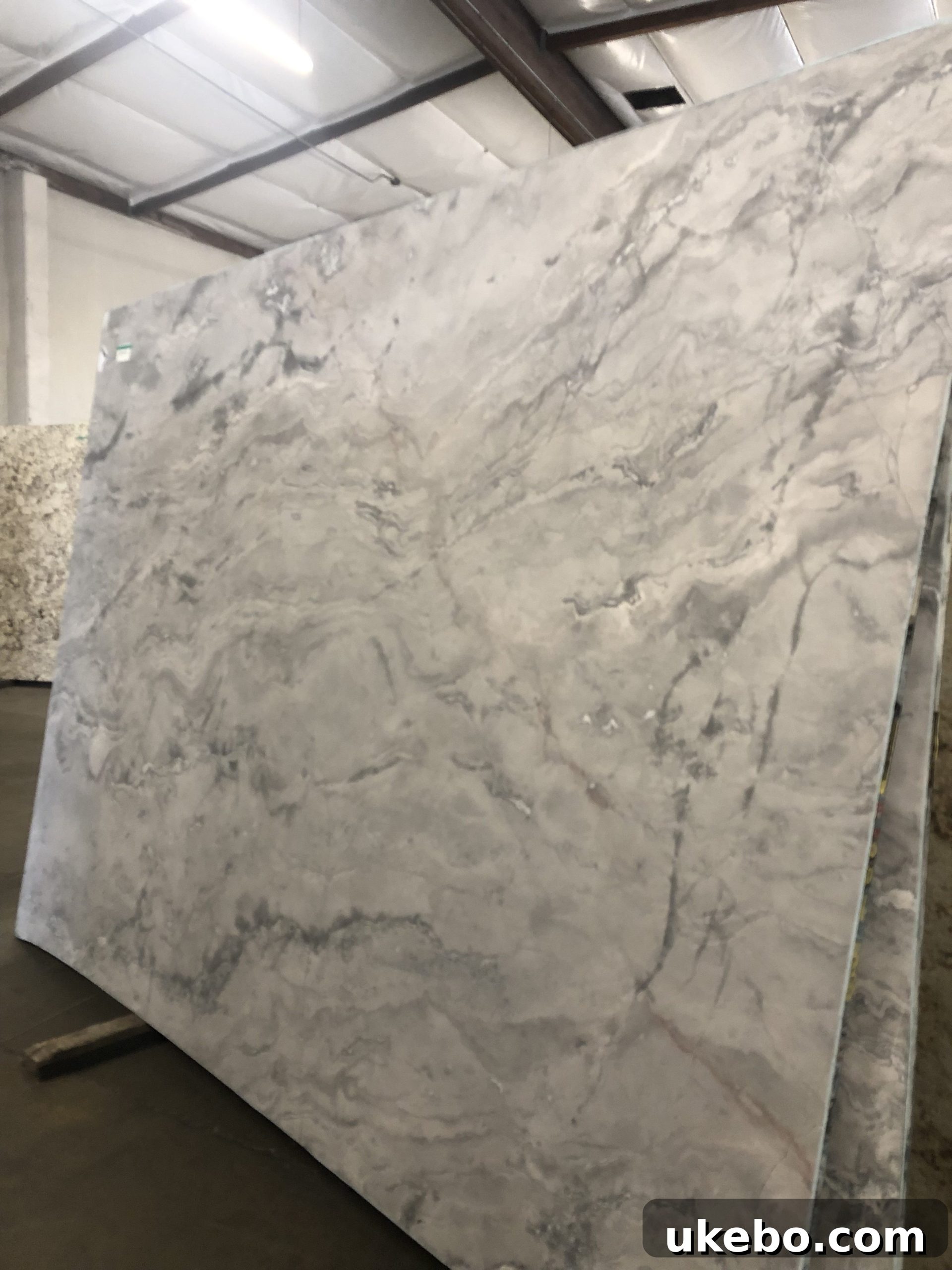 Rows of granite and quartz slabs in a stone yard