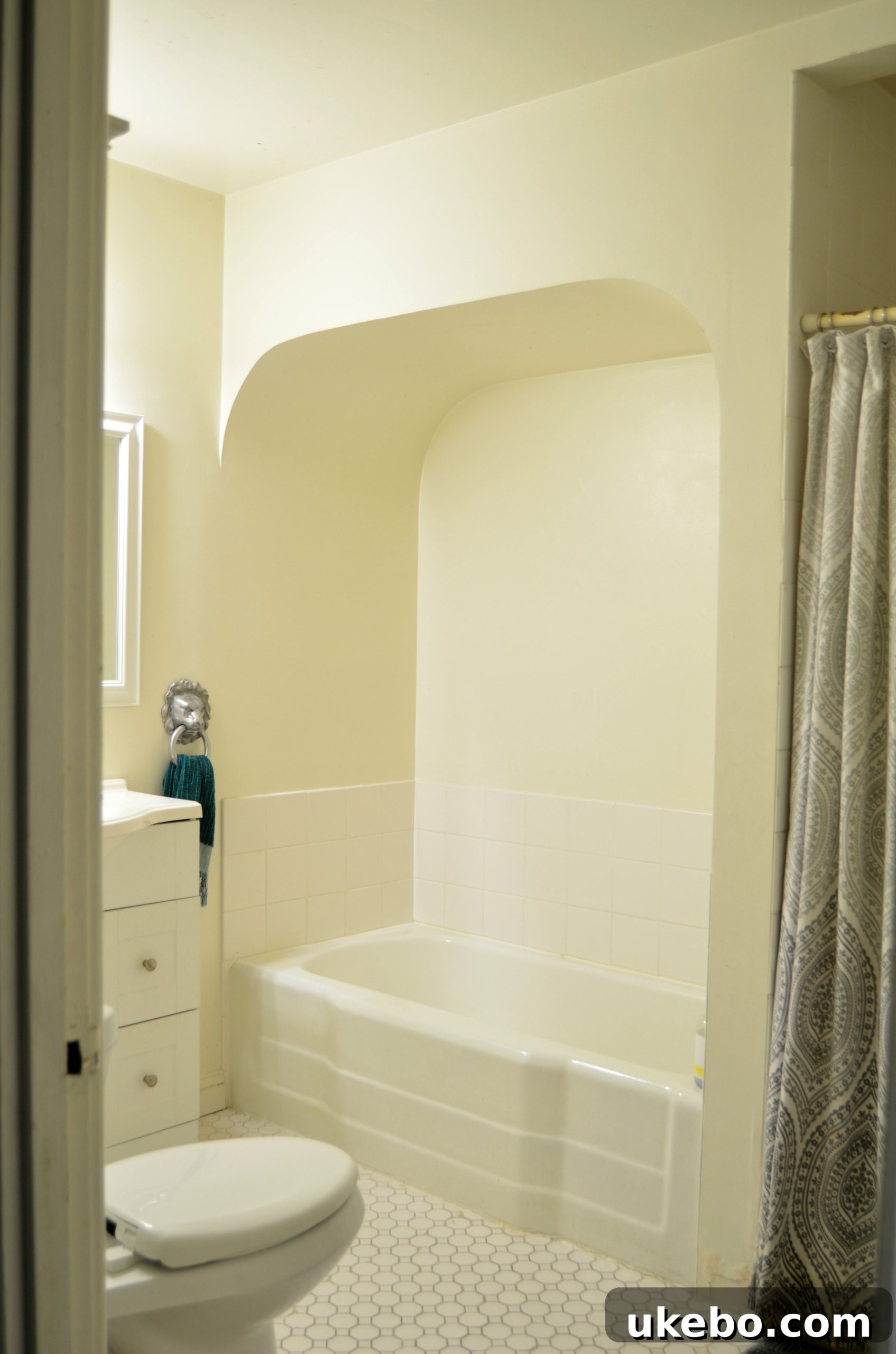 Another view of the old bathroom, highlighting its lack of natural light and claustrophobic feel.