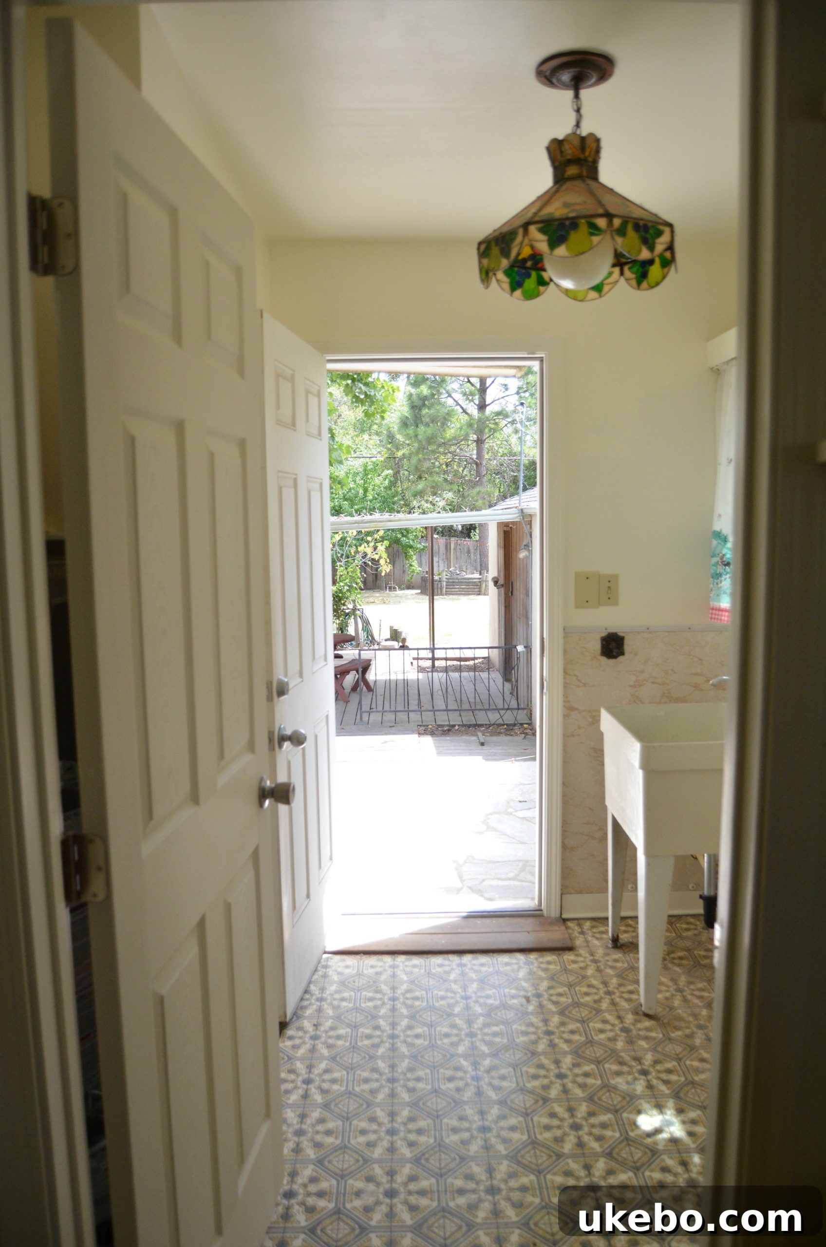 Before: Another angle of the old laundry room, emphasizing the limited space and the need for a comprehensive renovation.