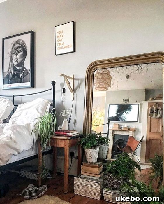 Inspiration image: elegant display of plants in front of a floor mirror on a console table