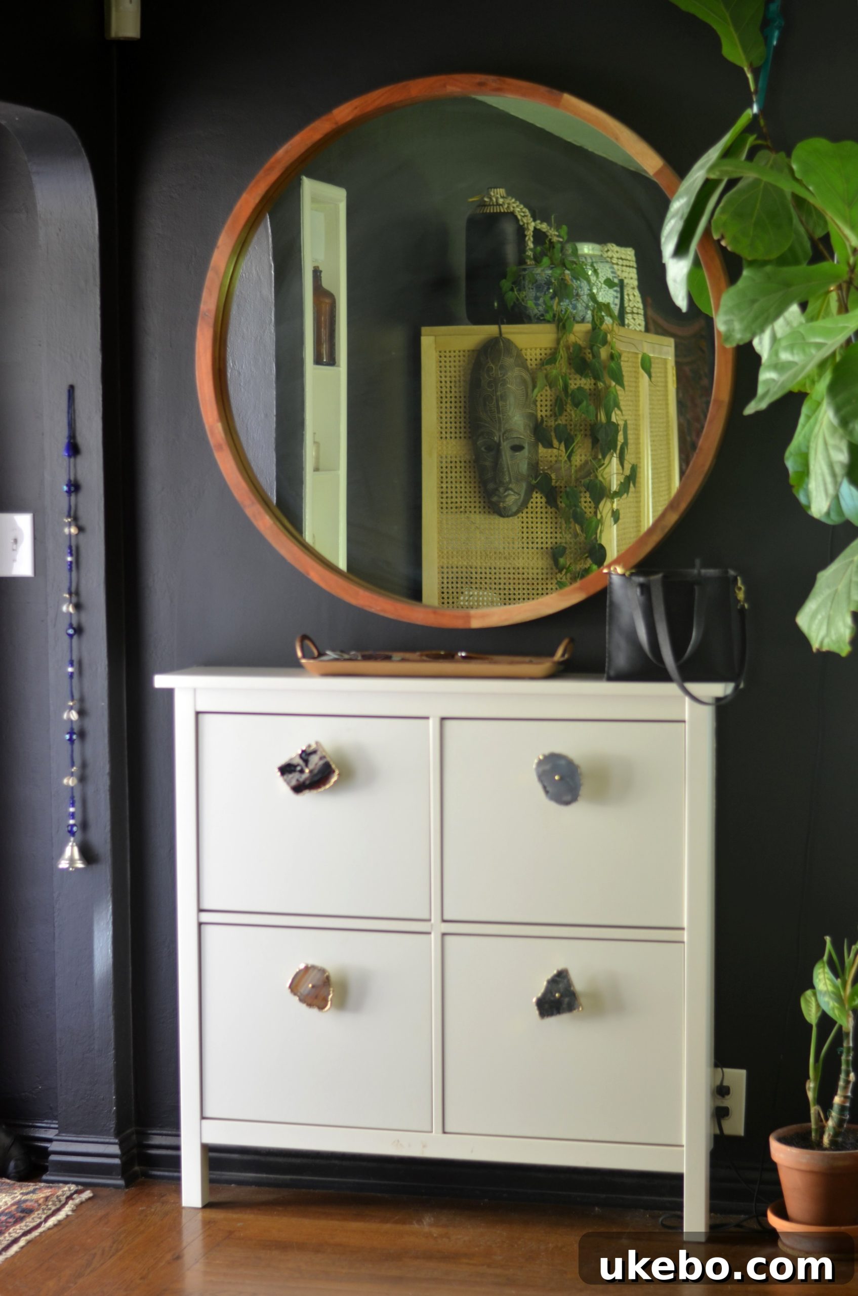 Close-up of entryway console with decor