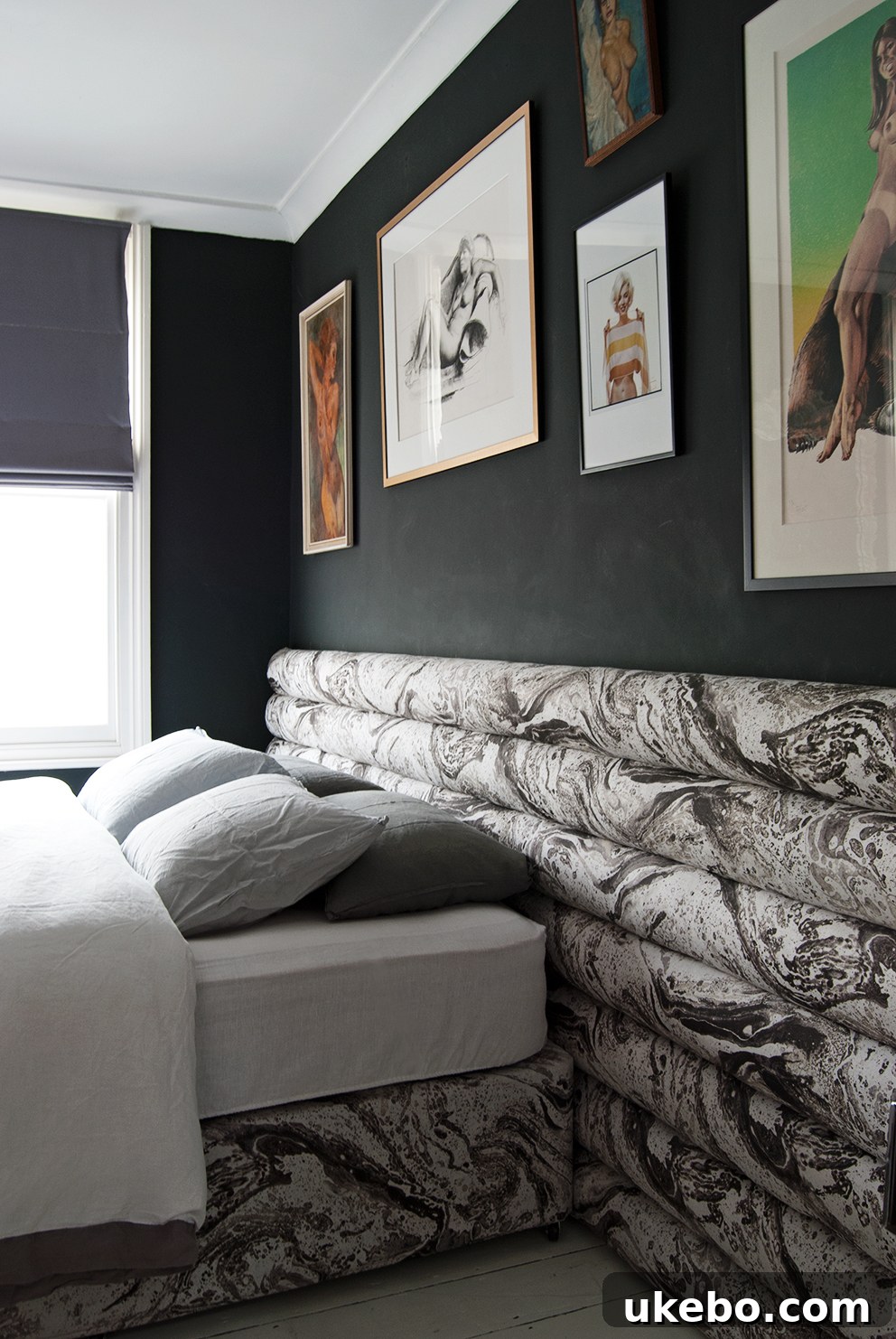 Luxurious channel tufted bed with high, vertical channels, creating an opulent bedroom atmosphere.