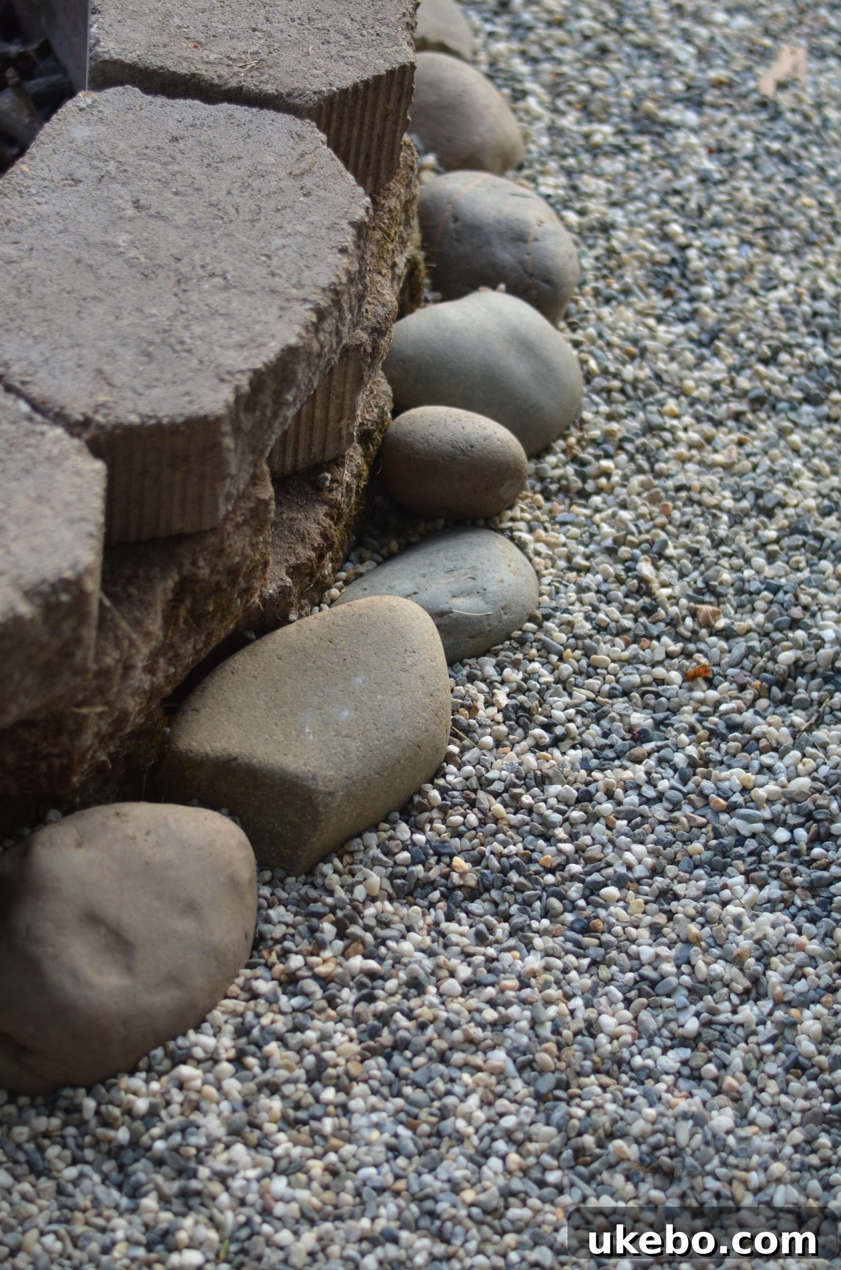 Crafting Your Perfect Summer Outdoor Oasis with POLYWOOD 14 Salt and pepper decorative rocks forming the floor of the fire pit area