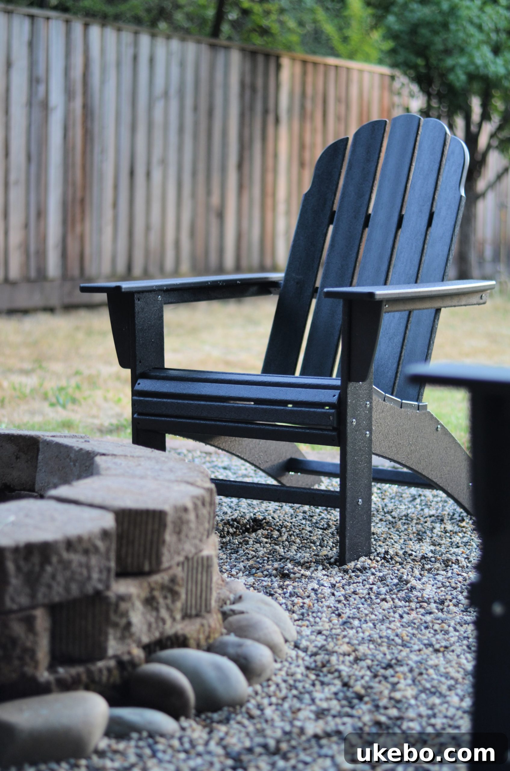 Crafting Your Perfect Summer Outdoor Oasis with POLYWOOD 18 Close-up of the comfortable POLYWOOD Curveback Adirondack Chair